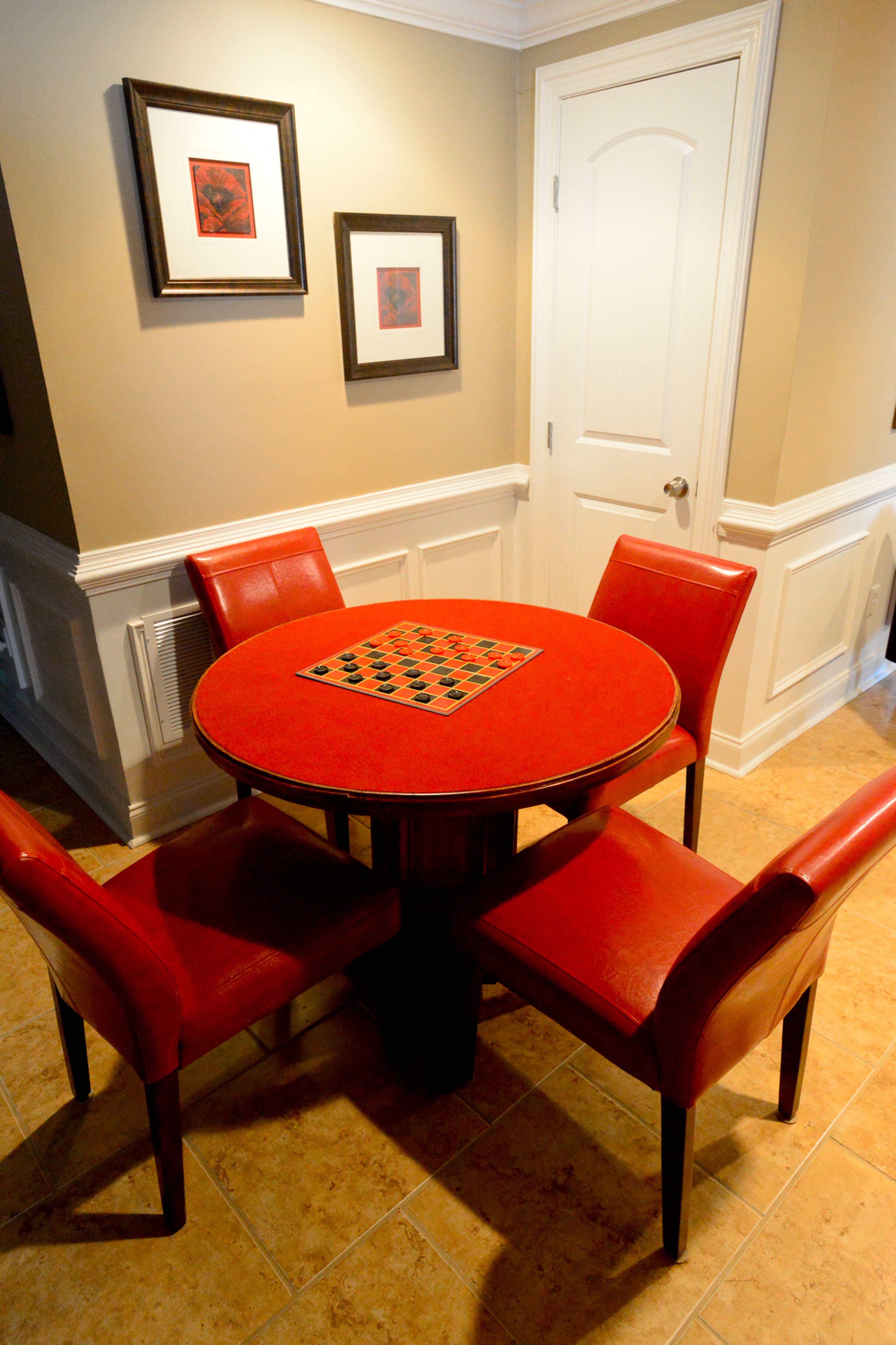 Homeowner Frances Pace is proud of the game table that she designed and built, with help from her husband, Garnell. The base is a spool that was topped by a piece of wood from The Home Depot covered in red felt. The entire piece was stained and the chairs are from American Signature Furniture.