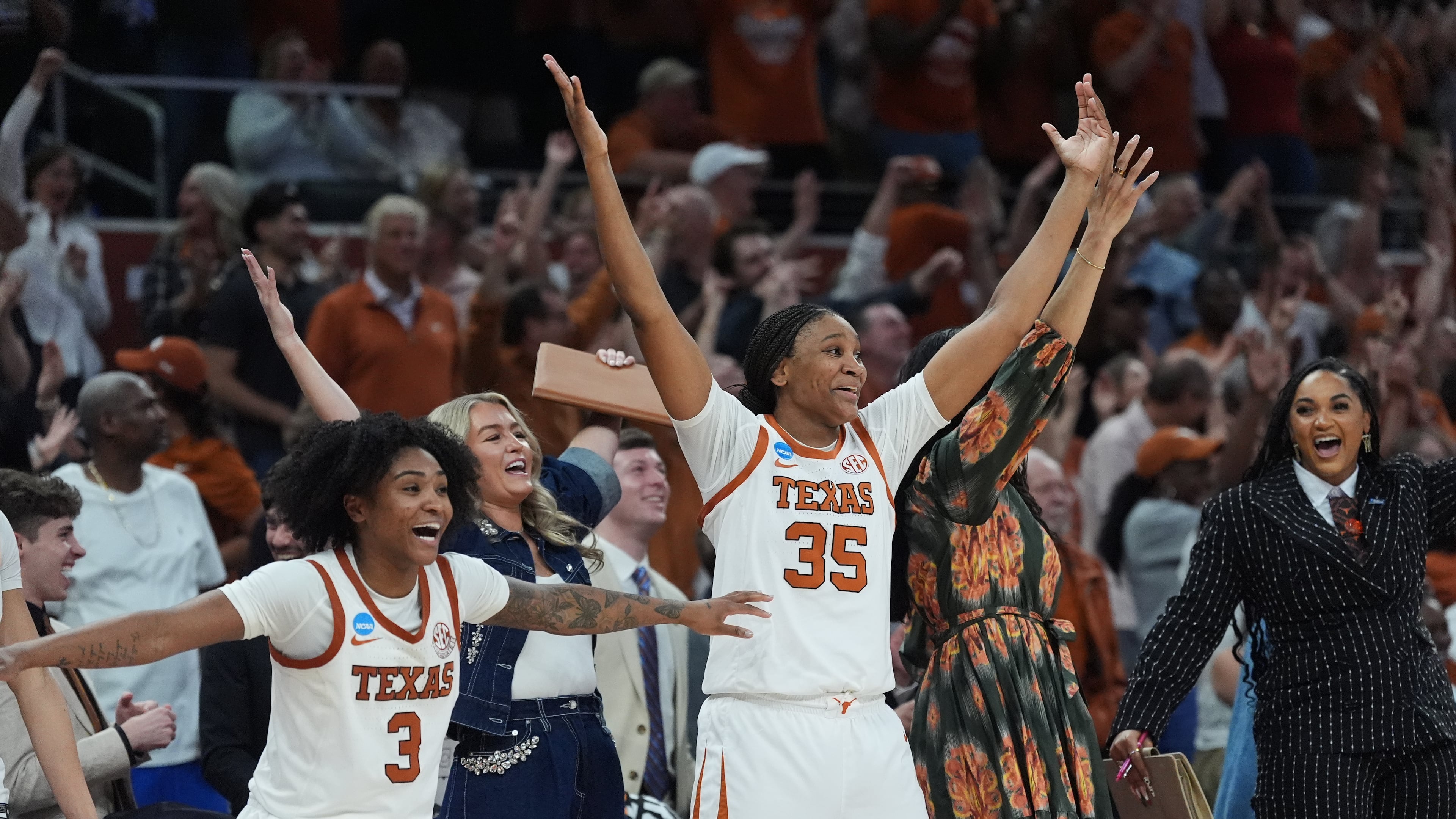 Texas guard Rori Harmon (3) and forward Madison Booker (35) celebrate their win over Oregon in the second round of the NCAA college basketball tournament, Sunday, March 22, 2026, in Austin, Texas. (AP Photo/Eric Gay)