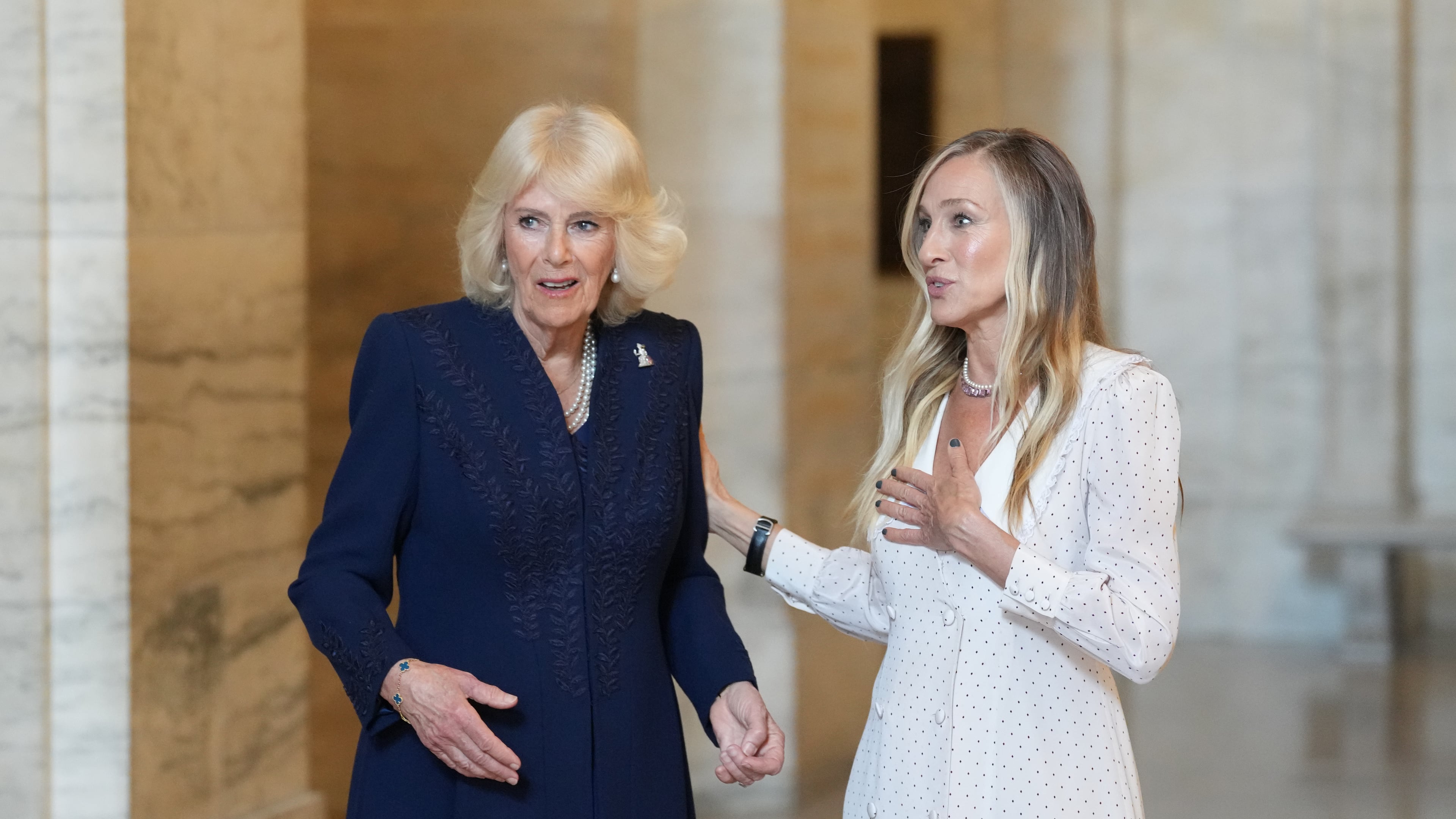 Actress Sarah Jessica Parker, right, talks with Queen Camilla at the New York Public Library, Wednesday, April 29, 2026, in New York. (Adam Gray/Pool Photo via AP)
