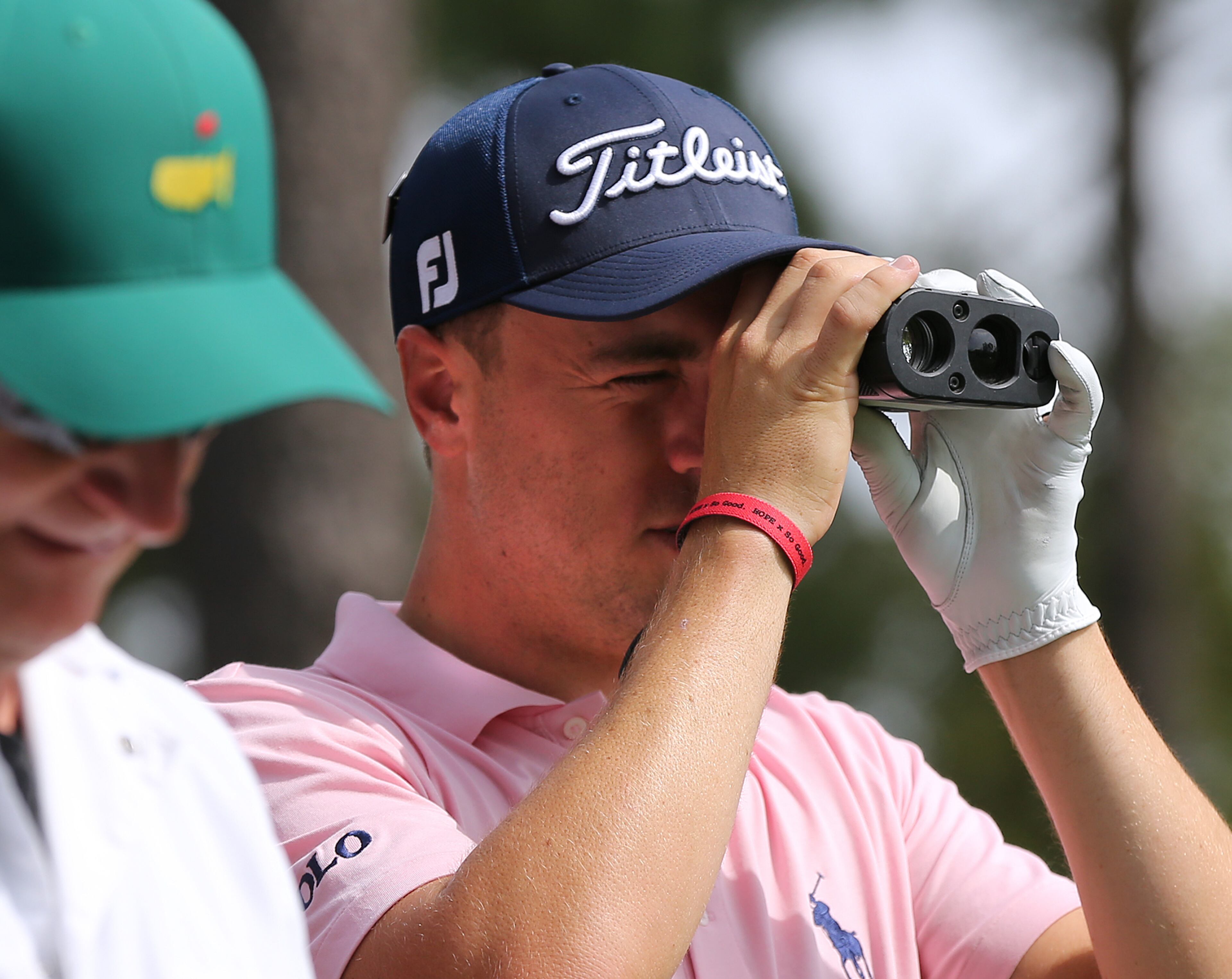 April 2, 2018 Atlanta: Justin Thomas checks the distance from the fourth tee box to the flag stick on the par-3 hole during his practice round for the Masters at Augusta National Golf Club on Monday, April 2, 2018, in Augusta. Curtis Compton/ccompton@ajc.com