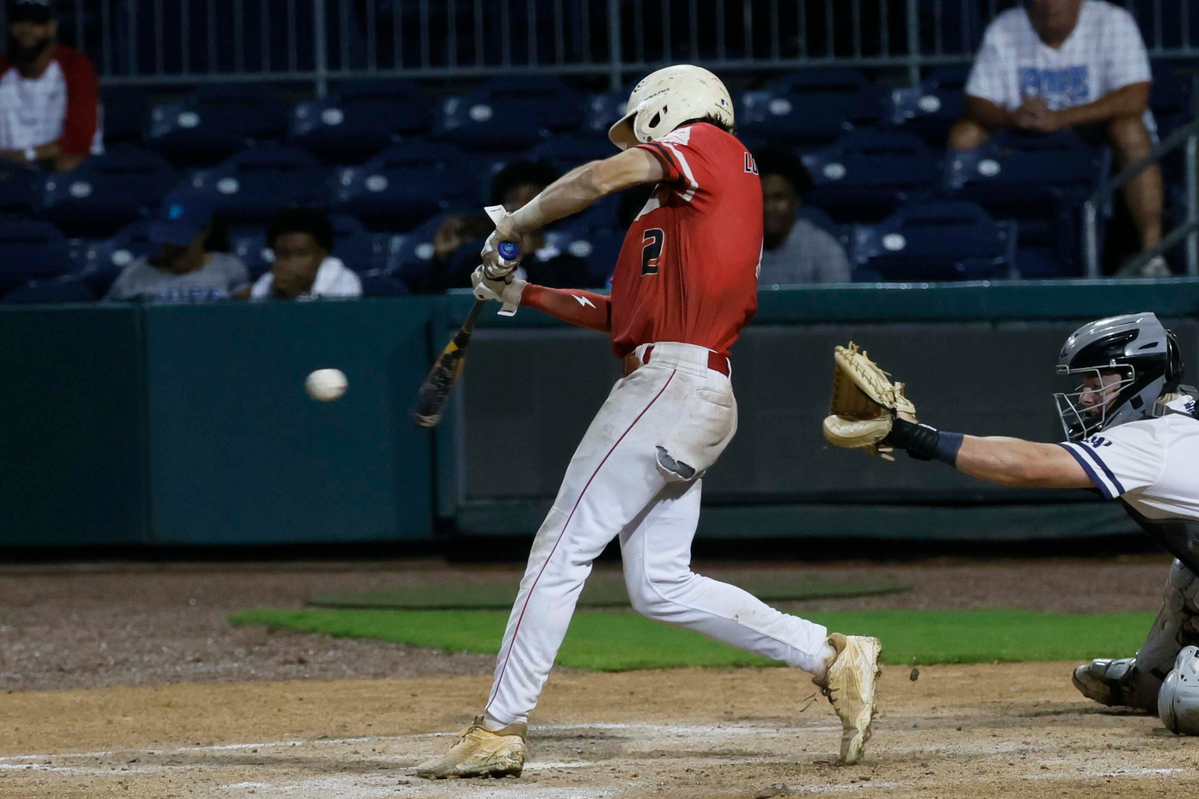 Loganville Brantley Carter (2) hits the walk-off to score 2 runs during the seventh inning in Game 3 of the Class 5A GHSA Baseball State Championship Series at Gwinnett Field on Tuesday, May 26, 2026, in Lawrenceville, Ga. Loganville beat Pope 4-3. (Miguel Martinez/AJC)