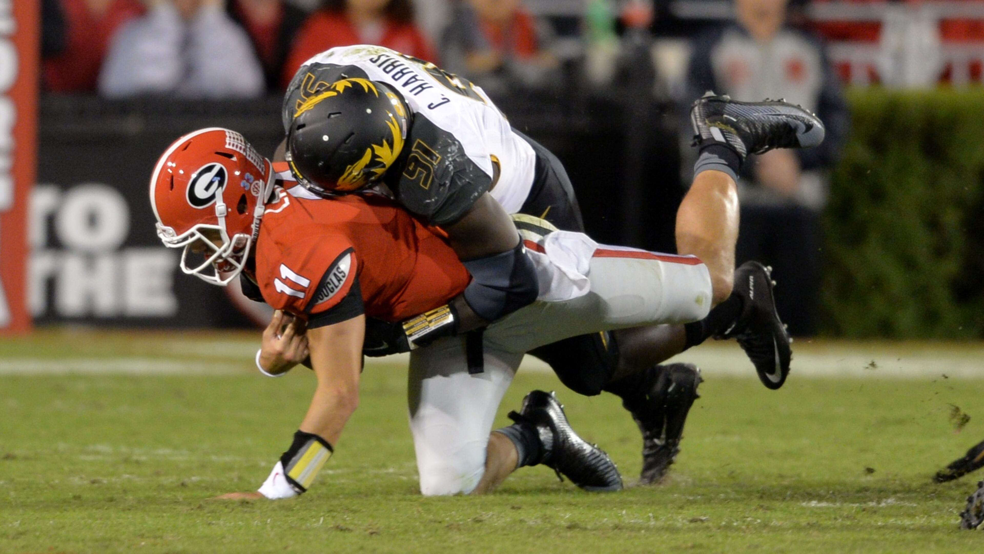 Georgia Bulldogs quarterback Greyson Lambert is brought down by Missouri Tigers defensive end Charles Harris during the second half in Athens on Oct. 17, 2015. BRANT SANDERLIN/BSANDERLIN@AJC.COM