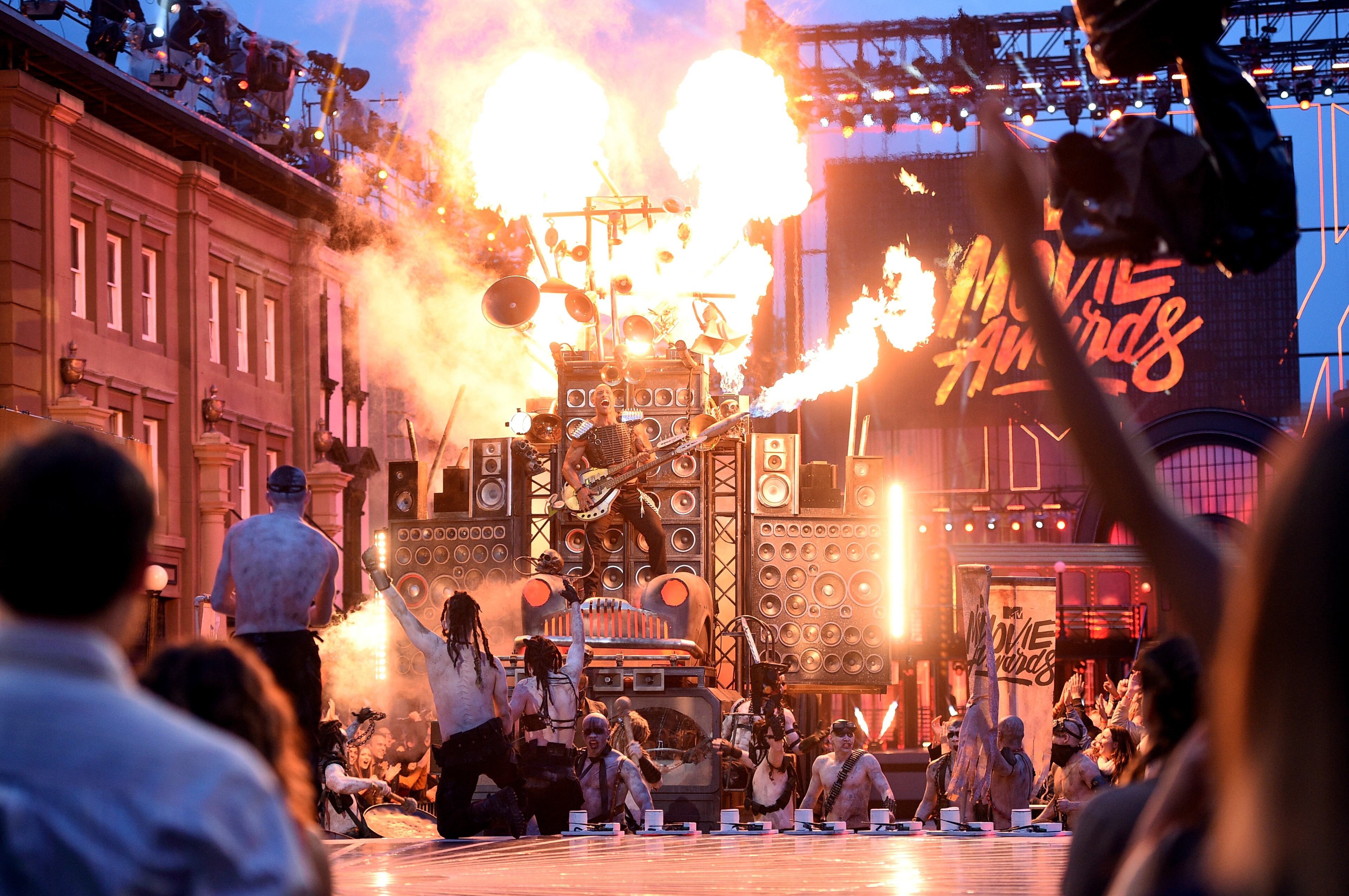 BURBANK, CALIFORNIA - APRIL 09: Co-host Dwayne Johnson speaks onstage during the 2016 MTV Movie Awards at Warner Bros. Studios on April 9, 2016 in Burbank, California. MTV Movie Awards airs April 10, 2016 at 8pm ET/PT. (Photo by Larry Busacca/Getty Images for MTV)
