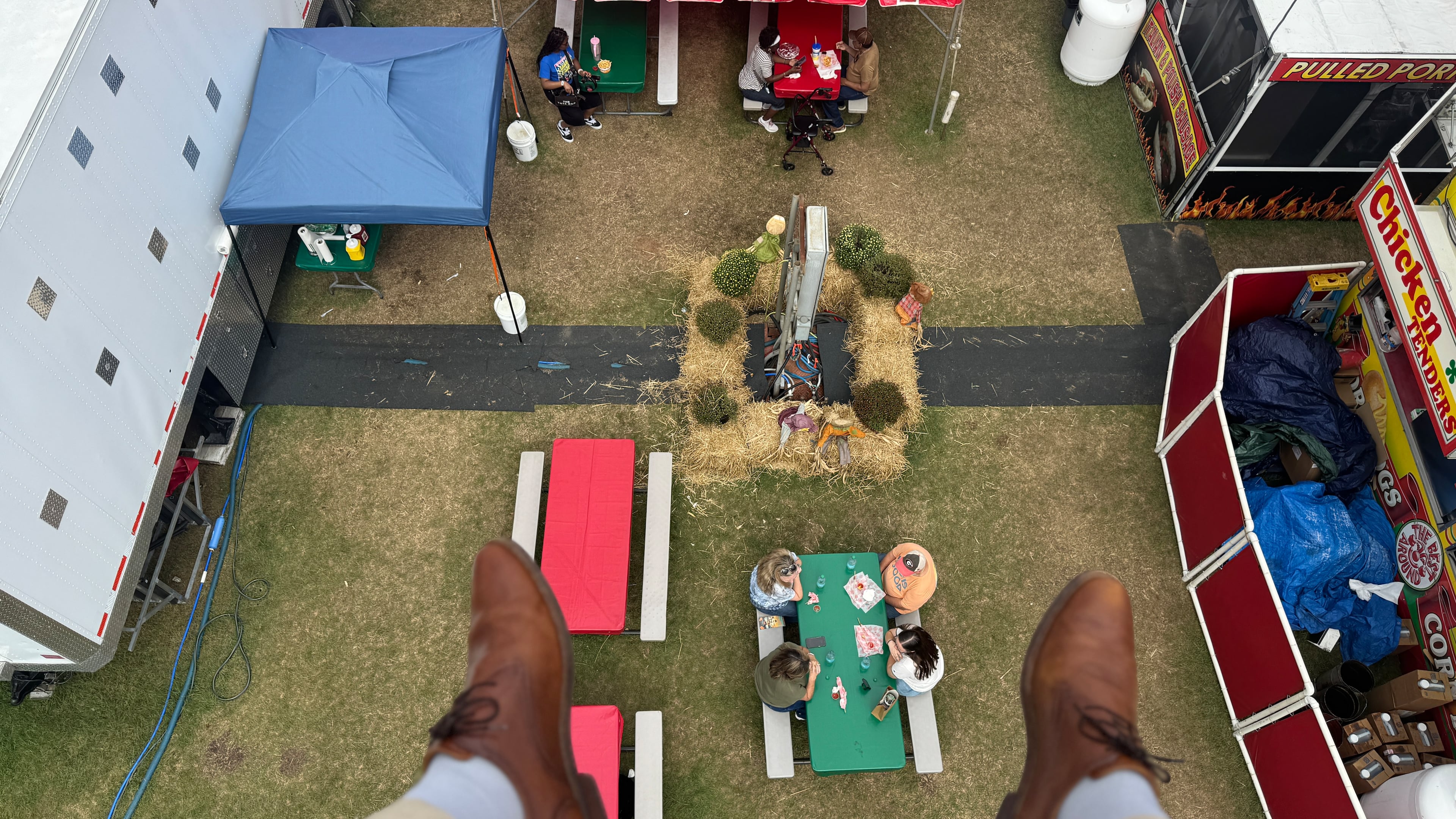 A bird's-eye view of the Georgia National Fair from about 40 feet up. Riders aboard the ski-lift-like attraction pay $10 for a one-way ride that covers about 1,400 feet of fair space. (Joe Kovac Jr./AJC)