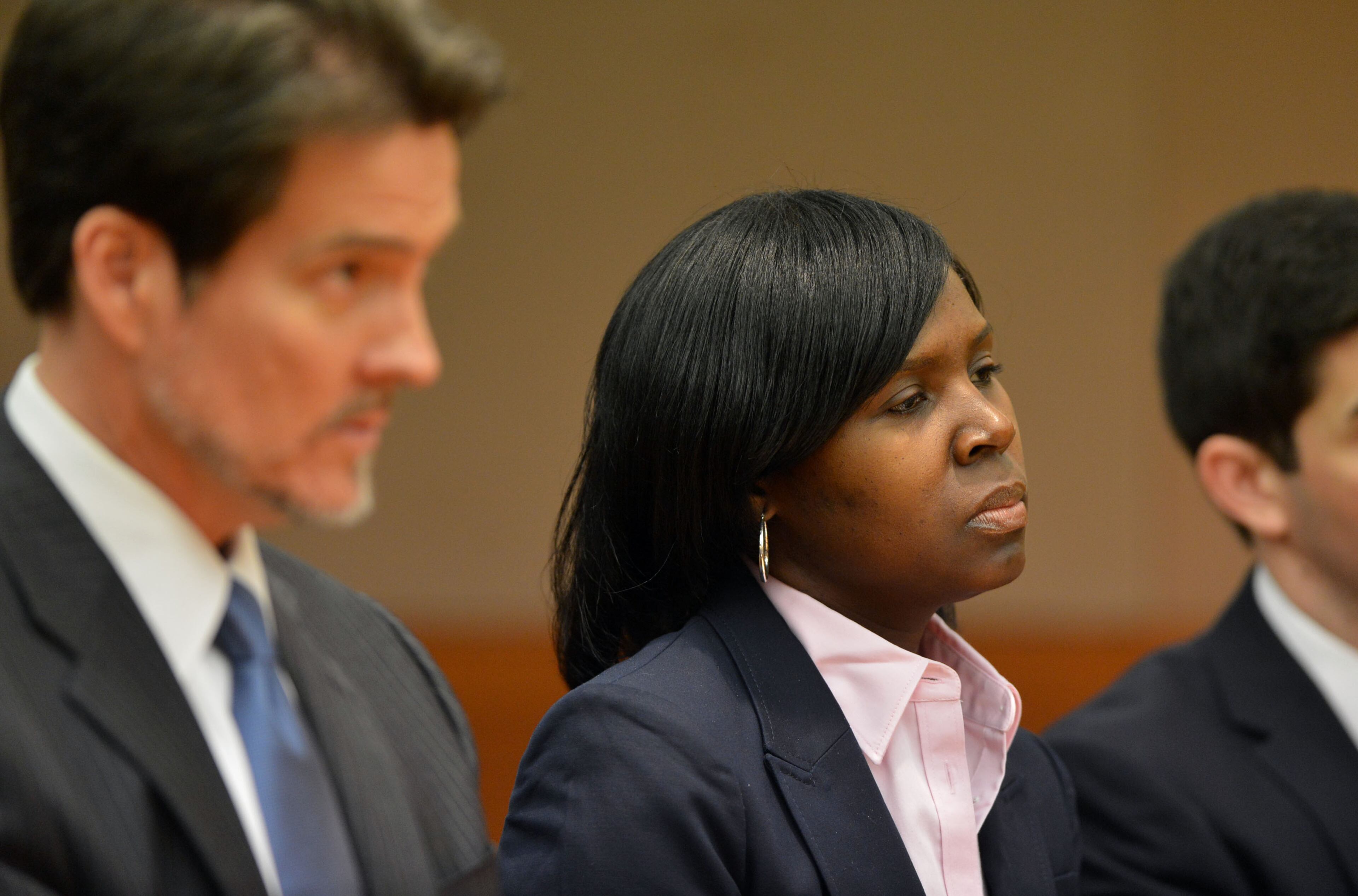 Sandra Ward, sits with her attorney Page Pate during the hearing. Ward, a former administrator at Parks Middle School, pleaded guilty to a reduced charge. She was sentenced to serve one year probation, repay $5,000 she received in bonus money, perform 250 hours of community service and cooperate with the prosecution. Educators in the Atlanta Public Schools cheating scandal enter pleas before Judge Jerry Baxter in Fulton County Superior Court Friday, February 21, 2014. Any defendants in the widespread Atlanta Public Schools cheating case who don't make guilty pleas by the end of Friday will likely go on trial this spring, including Superintendent Beverly Hall and senior members of her staff. KENT D. JOHNSON / KDJOHNSON@AJC.COM