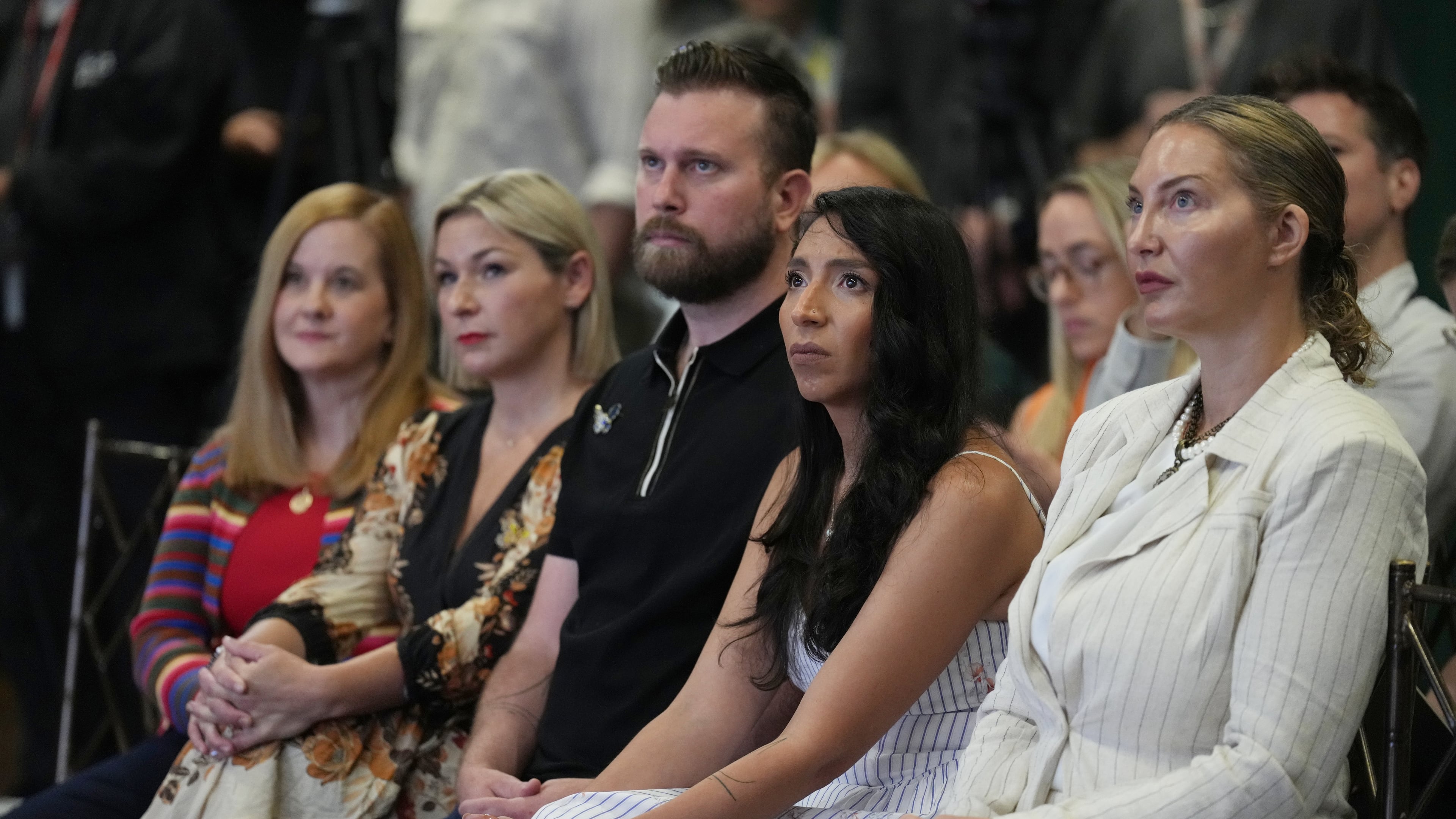 ADDS NAMES - Victims of Jeffrey Epstein sit in the front row, from left, Liz Stein, Dani Bensky, Sky Roberts, brother of a victim, Amanda Roberts, sister-in-law of a victim and Lara Blume McGee, as Democratic U.S. Senate candidate Texas state Rep. James Talarico speaks during an event in Dallas, Thursday, Sept. 10, 2026. (AP Photo/Jacquelyn Martin)