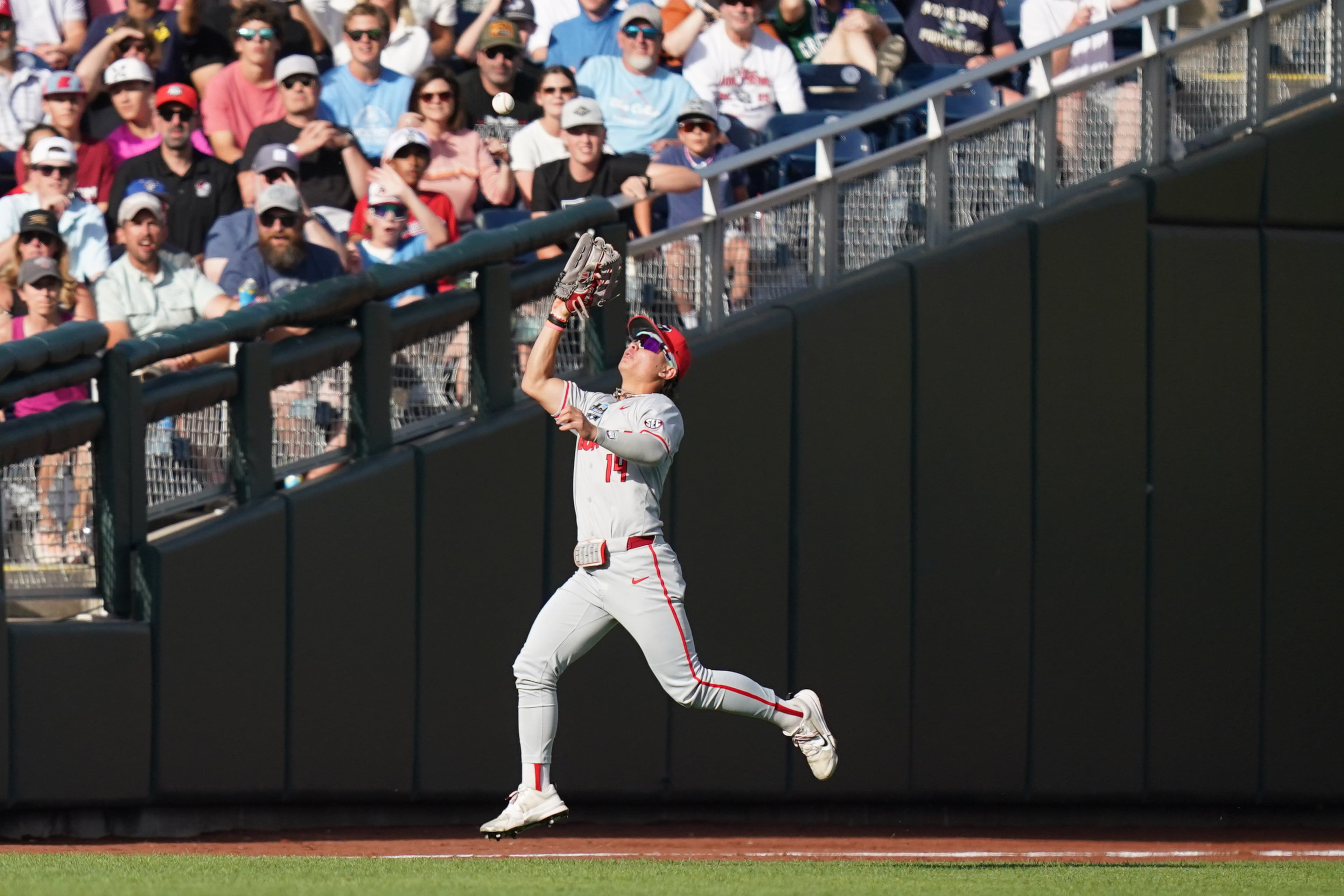 Georgia utility player Kenny Ishikawa makes the catch during a College World Series game against Oklahoma on Monday, June 15, 2026, in Omaha, Neb. (Vera Nieuwenhuis/AP)