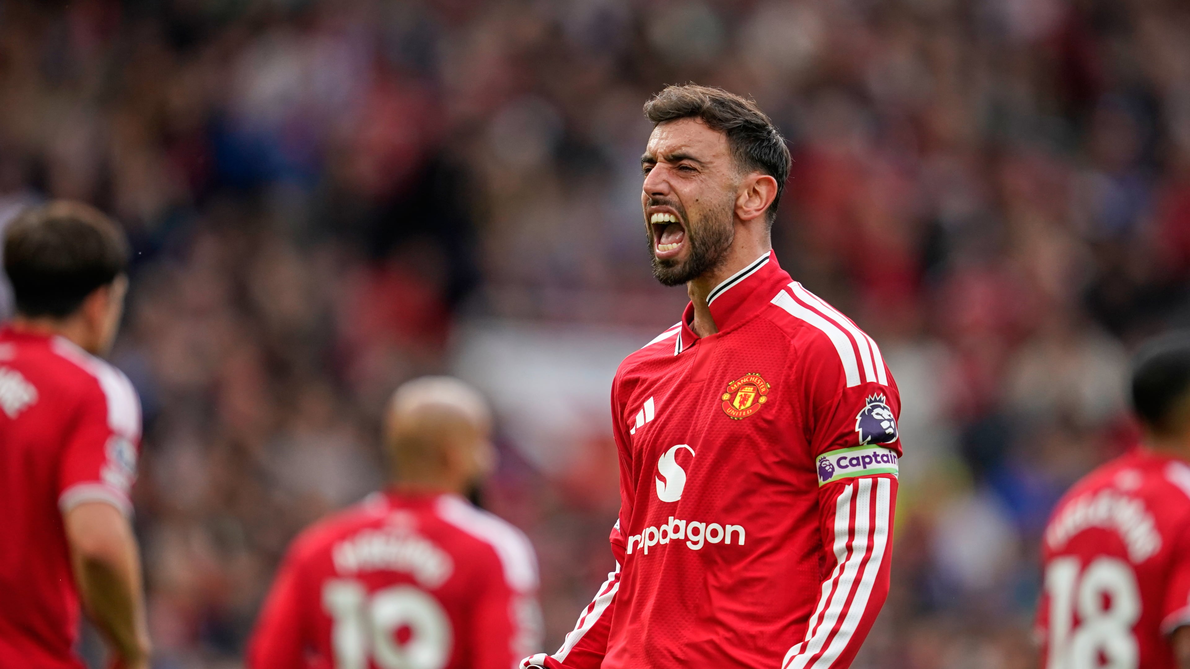Manchester United's Bruno Fernandes celebrates after scoring his side's third goal during the English Premier League soccer match between Manchester United and Ipswich Town in Manchester, England, Sunday, Aug. 30, 2026. (AP Photo/Dave Thompson)