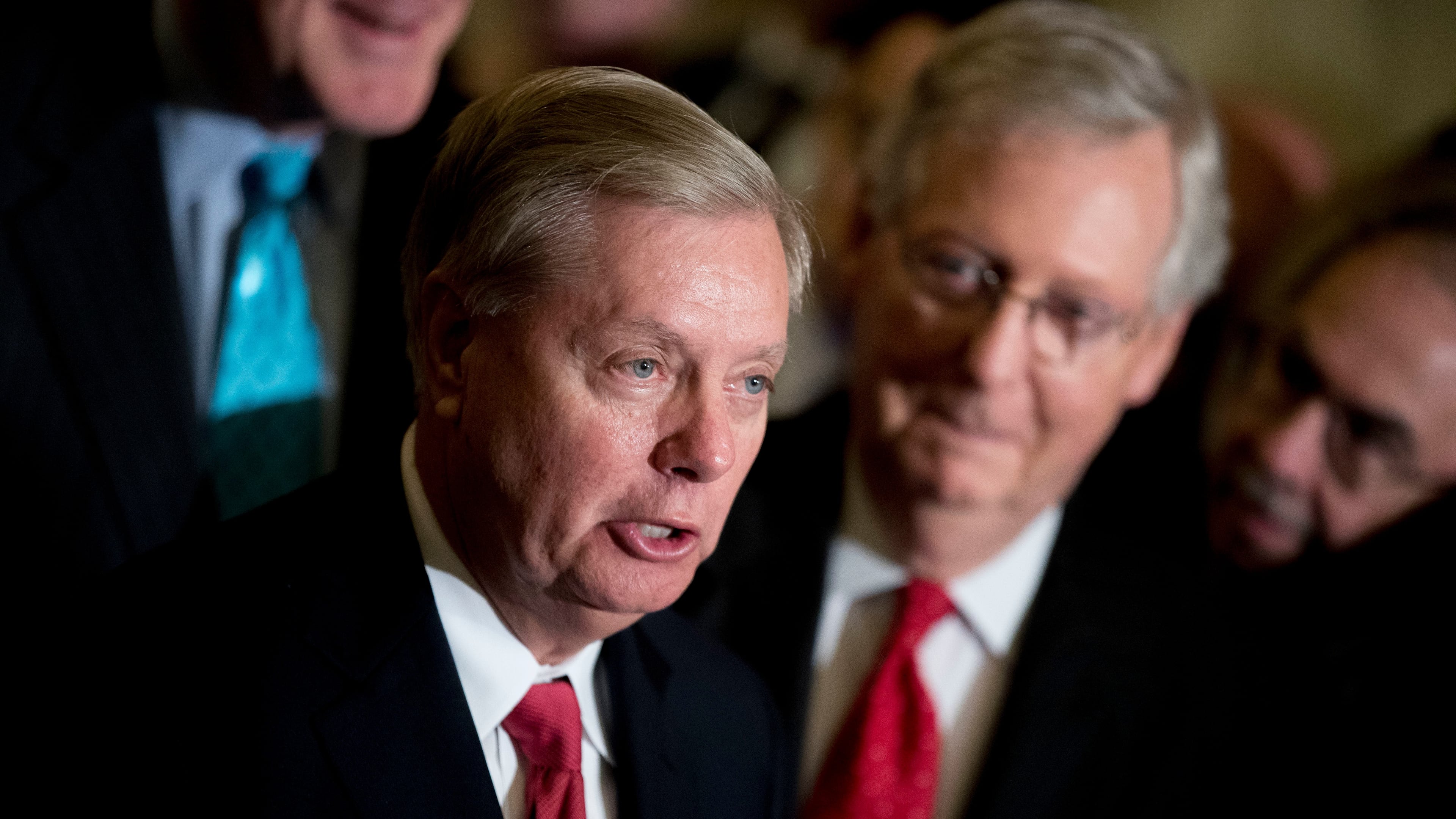 Sen. Lindsey Graham — pictured alongside Sen. Mitch McConnell in 2017 — died Saturday night of what the preliminary medical examiner report says was a tear in his aorta. (Andrew Harnik/AP)