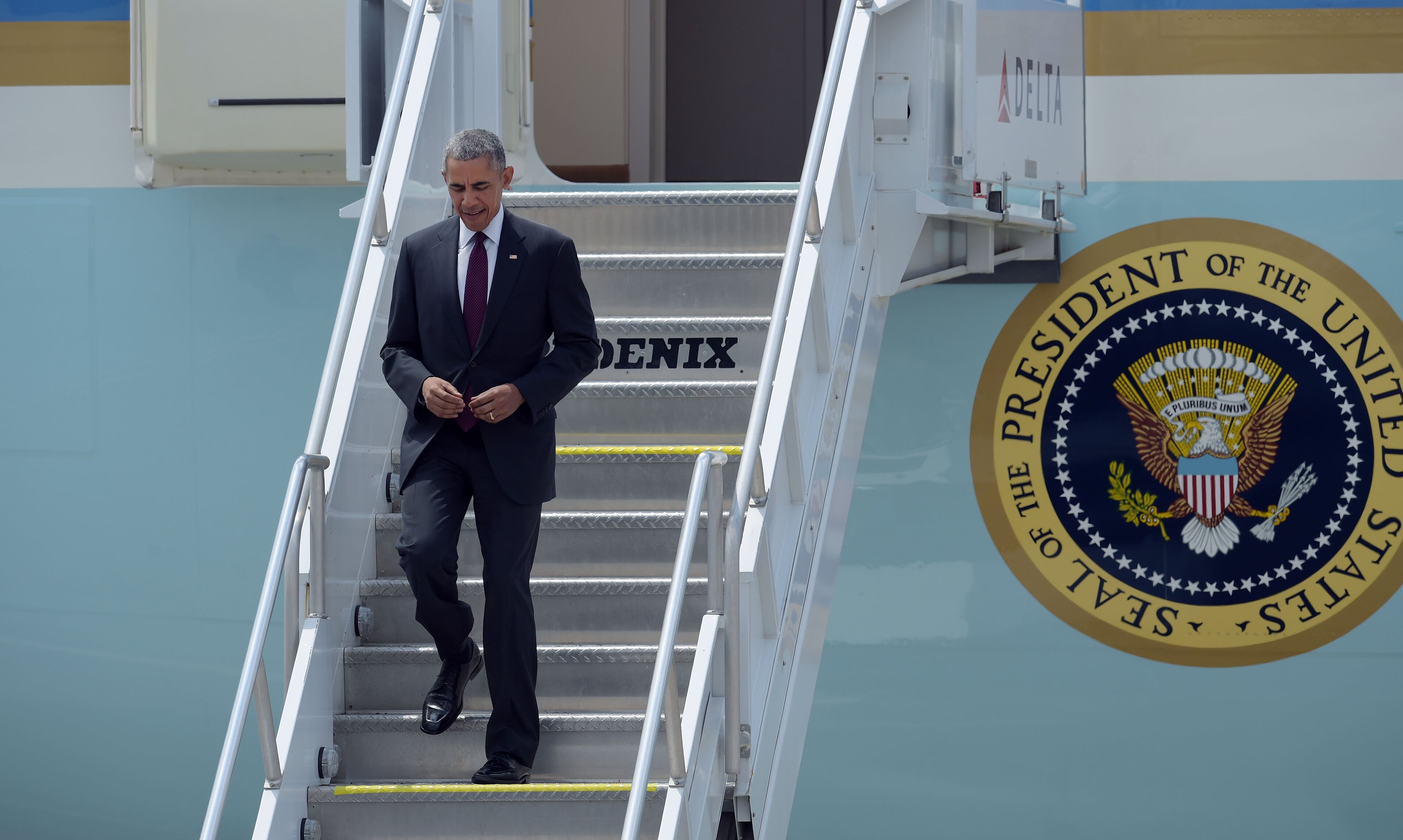 President Barack Obama exits Air Force One as he arrives at Hartsfield-Jackson International Airport for a speech to the Disabled American Veterans and a fundraiser, Monday, August 1, 2016. KENT D. JOHNSON/KDJOHNSON@AJC.COM