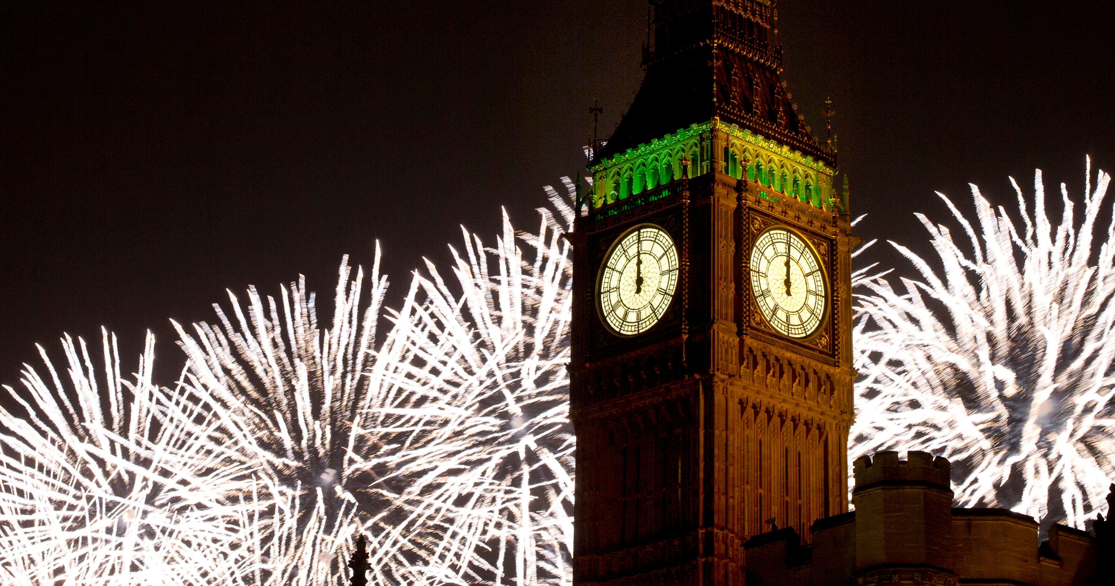 Fireworks explode over the Houses of Parliament, including Queen Elizabeth II tower which holds the bell known as Big Ben as London celebrates the arrival of New Year's Day Wednesday, Jan. 1, 2014. The annual firework display is the culmination of the New Year's Eve celebrations.(AP Photo/Alastair Grant)
