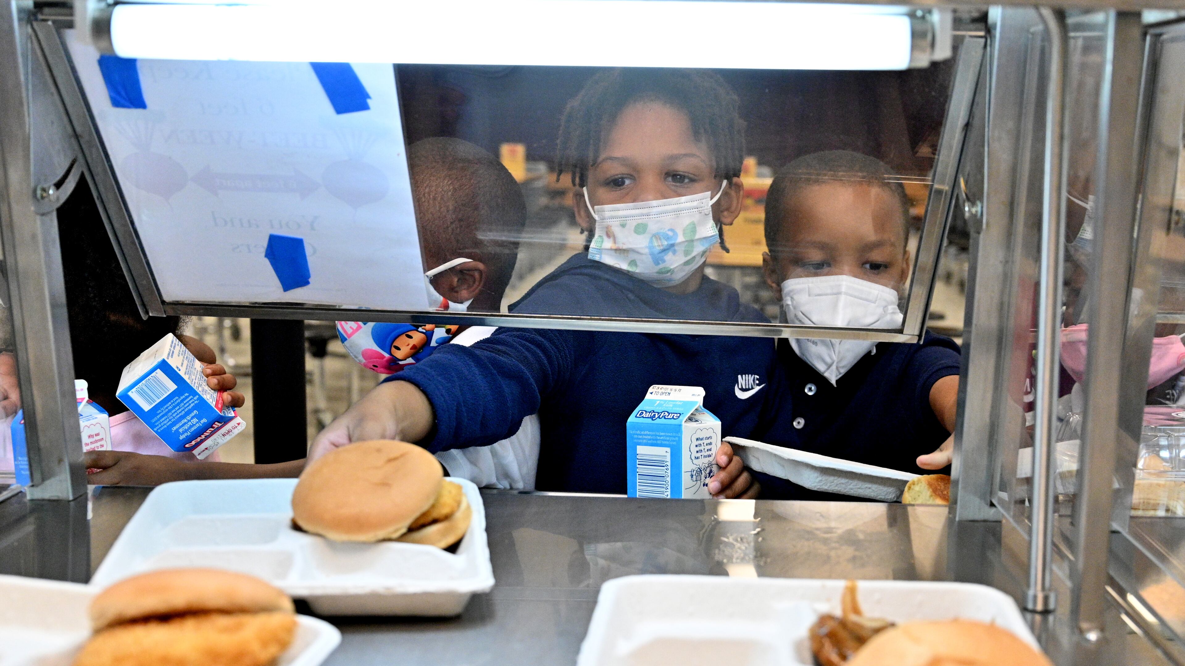 Kindergartner King Langford, 5, picks up his lunch at Cliftondale Elementary School in College Park on Wednesday, October 13. Metro Atlanta school districts are having to be creative to revise and rework menus because of national food supply issues. The COVID-19 pandemic has made it difficult for districts to get some of their usual food items. (Hyosub Shin / Hyosub.Shin@ajc.com)
