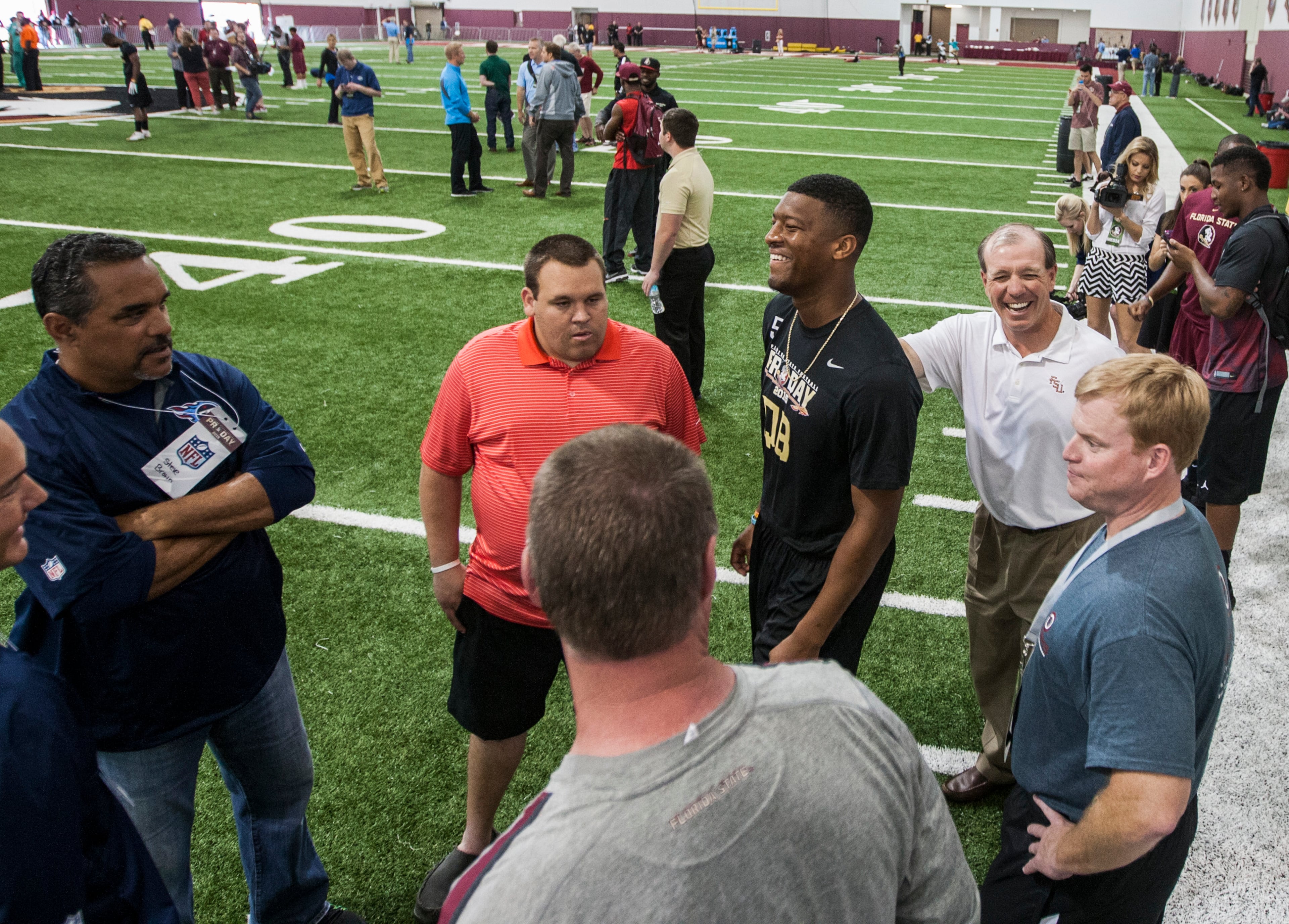Florida State head coach Jimbo Fisher, right, laughs with Jameis Winston as they talk to NFL scouts during Florida State football pro day in Tallahassee, Fla., Tuesday, March 31, 2015.
