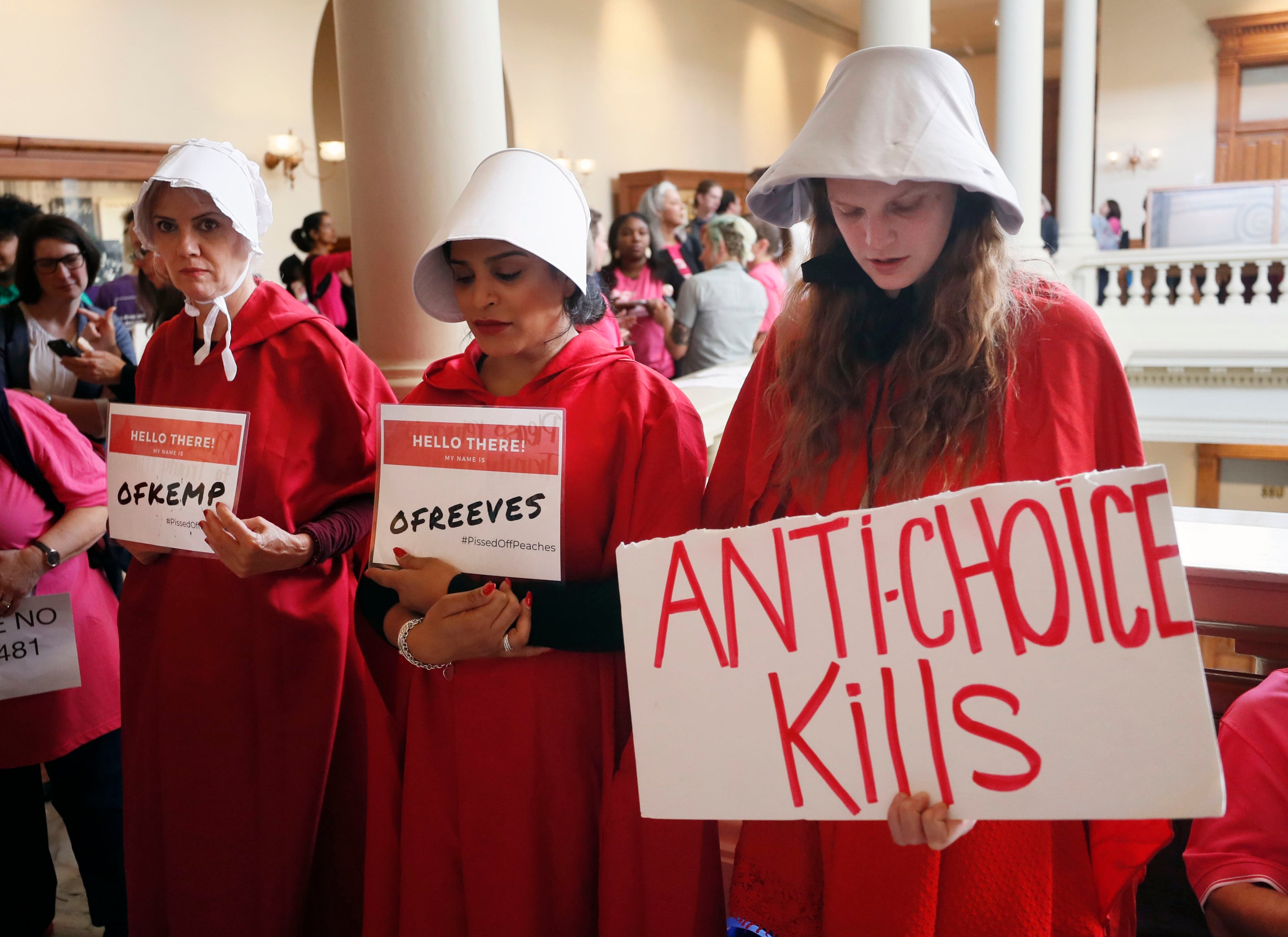 March 14, 2019 - Atlanta - Georgia members of the Handmaid Coalition were protesting HB 481 outside the Capitol today. A Senate hearing was held Thursday for the "fetal heartbeat bill." Advocates on both sides are expected to fill the Capitol as the committee debates the bill that would outlaw most abortions after six weeks. Bob Andres / bandres@ajc.com