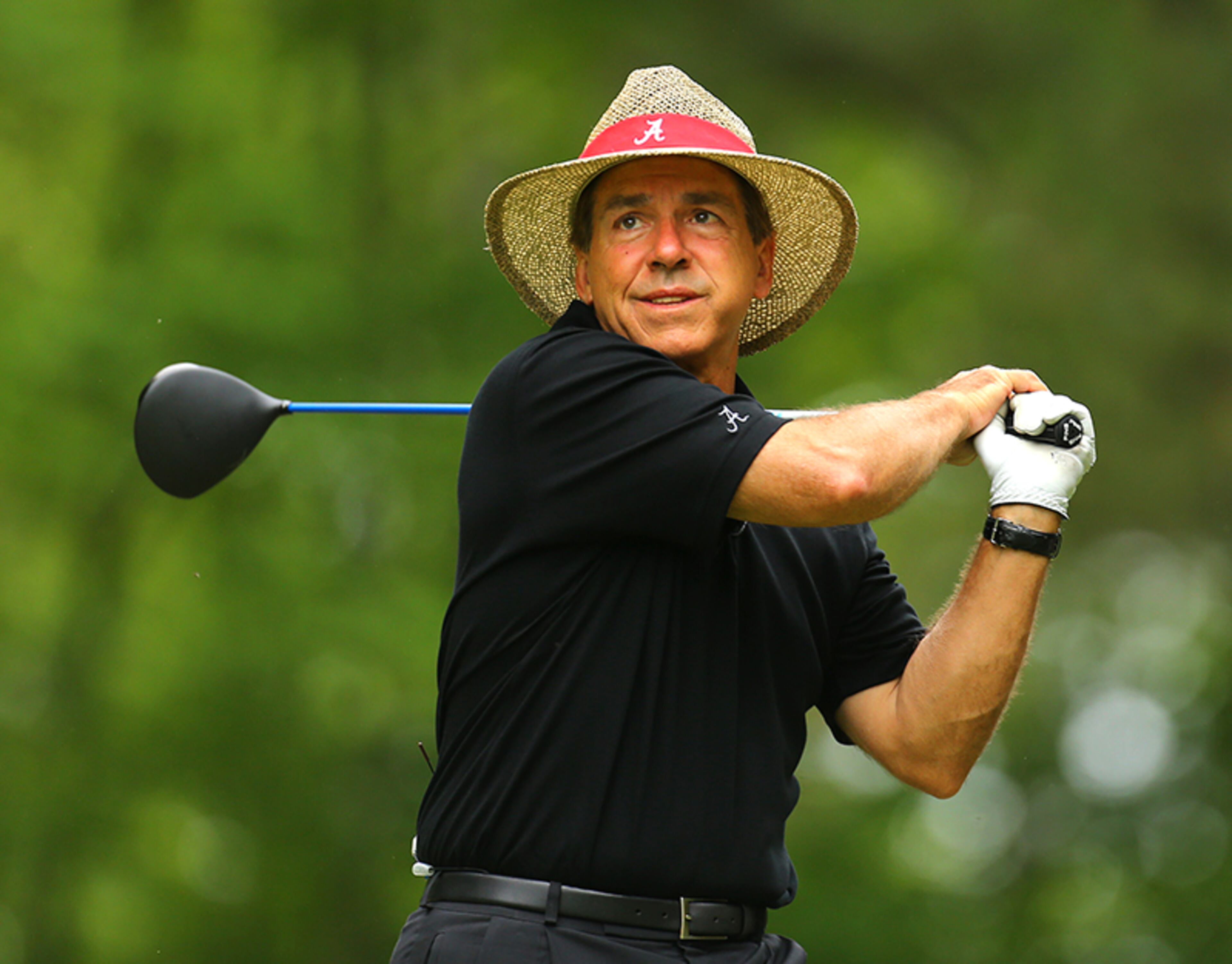 Alabama head football coach Nick Saban tees off on the No. 9 hole in the Chick-fil-A Bowl Challenge, featuring an 11-team field of NCAA head coaches and celebrity alumni at Reynolds Plantation on Tuesday, April 29, 2014, in Greensboro.