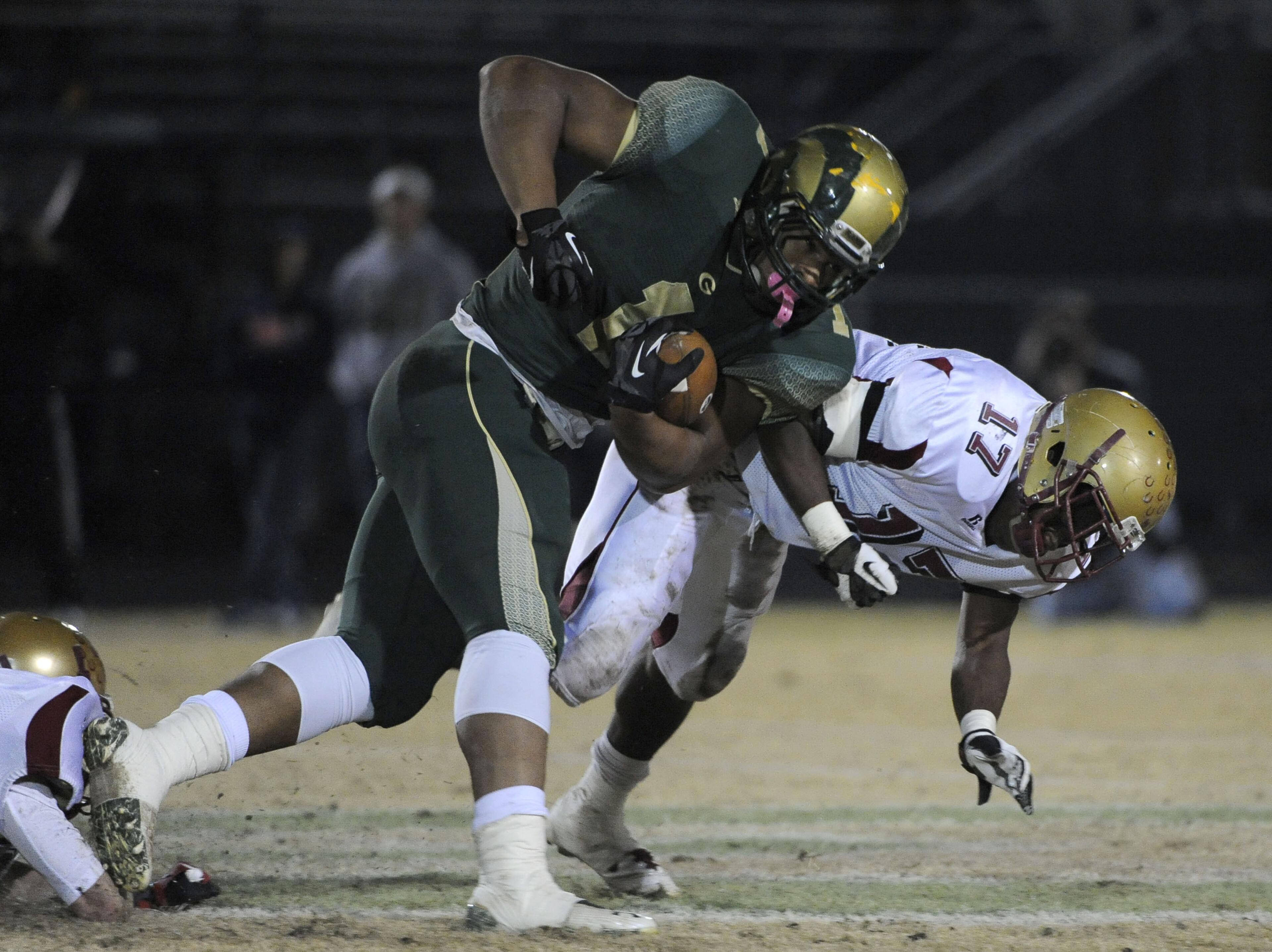 Grayson's Robert Nkemdiche (1) runs for extra yardage before Brookwood's Garrett Reynolds brings him down.