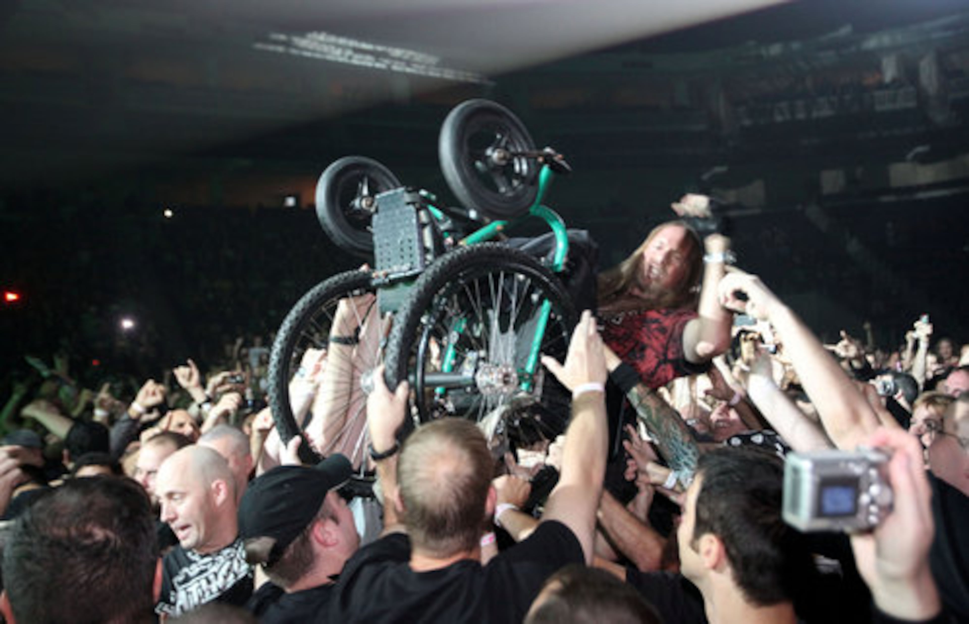 Dave Finney of Eufaula, Ala., crowd-surfs in a wheelchair.