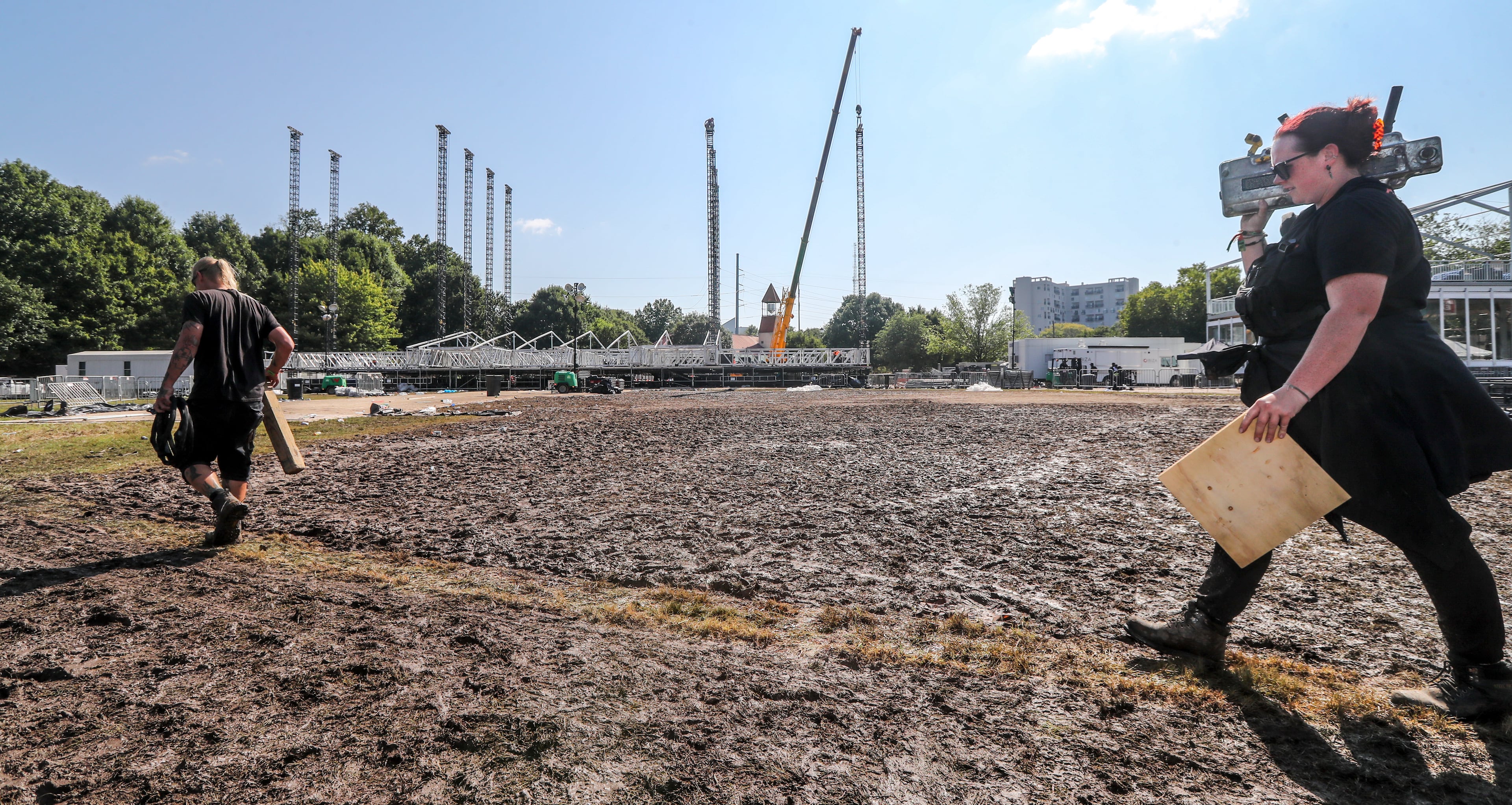 September 18, 2023 Atlanta: Todd Srodes (left) and Natasha Nash with Tactical Production Support moved equipment out of the main stag area as the sun was out on a mild Monday at Piedmont Park on Sept. 18, 2023 following the weekend’s Music Midtown. There was plenty of mud left behind near the stages where music fans congregated in the rain. Headliners included veteran pop singer Pink, brooding singer-songwriter Billie Eilish, classic rock band Guns N’ Roses and Atlanta hip-hop artist Lil Baby as the headliners from Sept. 15-17 at Piedmont Park. Live Nation returned the festival to three days, up from two in recent years, with about 40 acts in total. In recent years, the festival has accommodated at least 50,000 people per day. Since Music Midtown launched in 1994, it has drawn tens of thousands each year to see major acts such as Pearl Jam, Foo Fighters, Coldplay, Eminem, Van Halen, Post Malone, Bruno Mars and Miley Cyrus. There wikll be plenty of sunshine maybe with less wind, for the rest of the week. A small chance for a few showers returns for the weekend, Channel 2 Action News meteorologist Ashley Kramlich said. (John Spink / John.Spink@ajc.com)