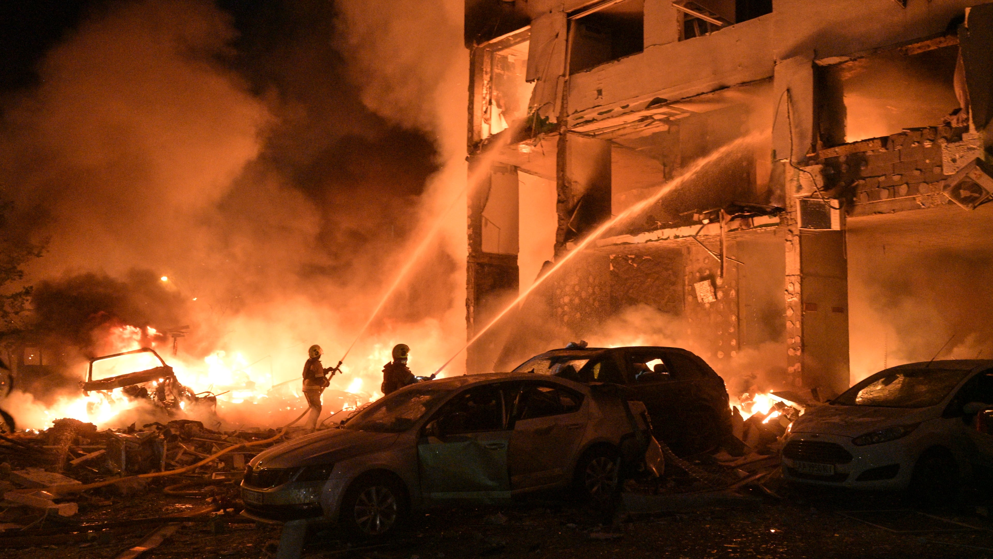 Emergency services personnel work to extinguish a fire following Russian missile attacks in Kyiv, Ukraine, Monday, July 6, 2026. (AP Photo/Danylo Antoniuk)