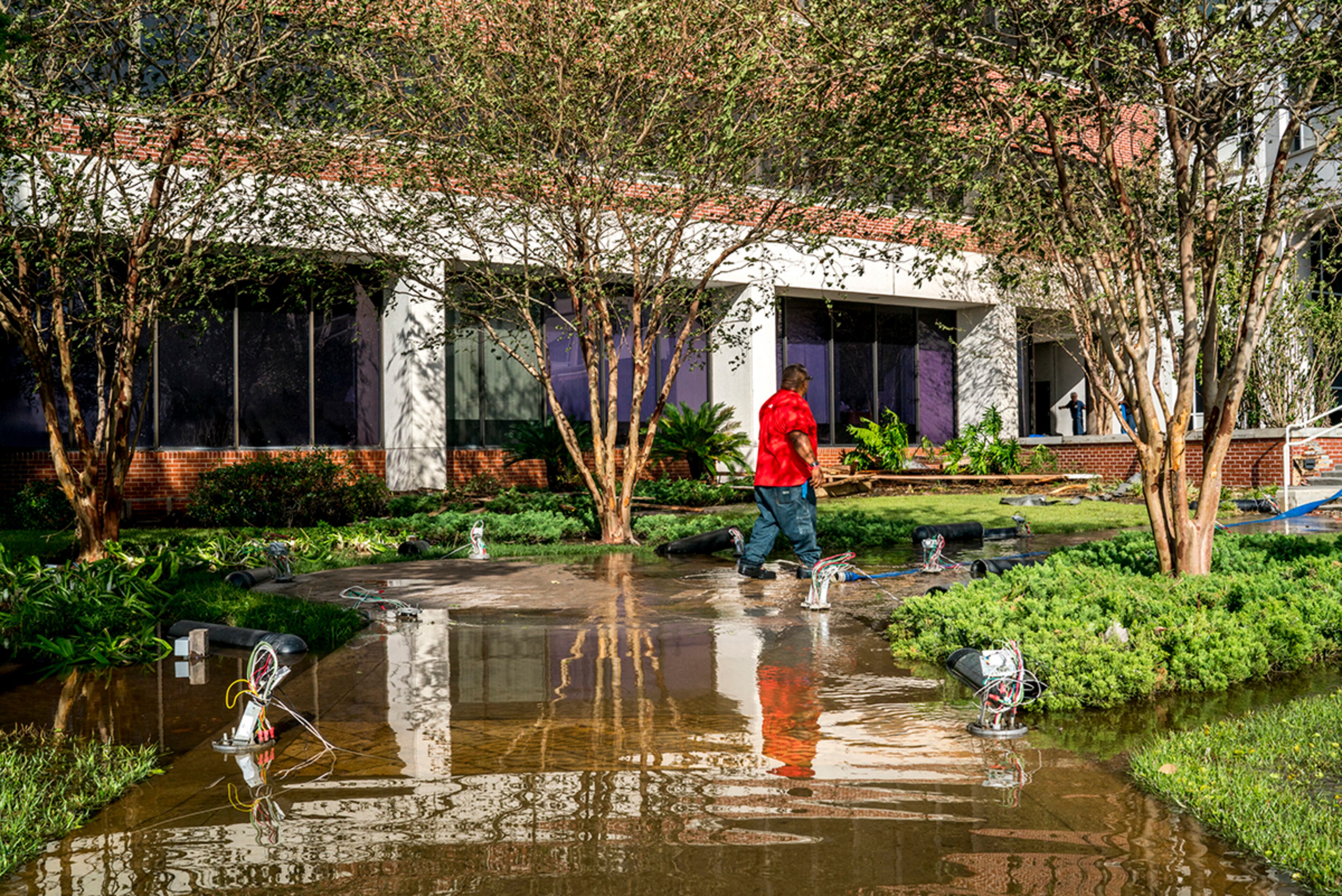 Jacksonville, Fla.: Workers pump floodwaters from an area at the St. Vincent's Medical Center Riverside, situated along the the St. Johns River in Jacksonville, Fla., Sept. 12, 2017. Downgraded to a tropical depression, Irma left Florida in shambles as it moved into Georgia, Alabama and the Carolinas. (Johnny Milano/The New York Times)