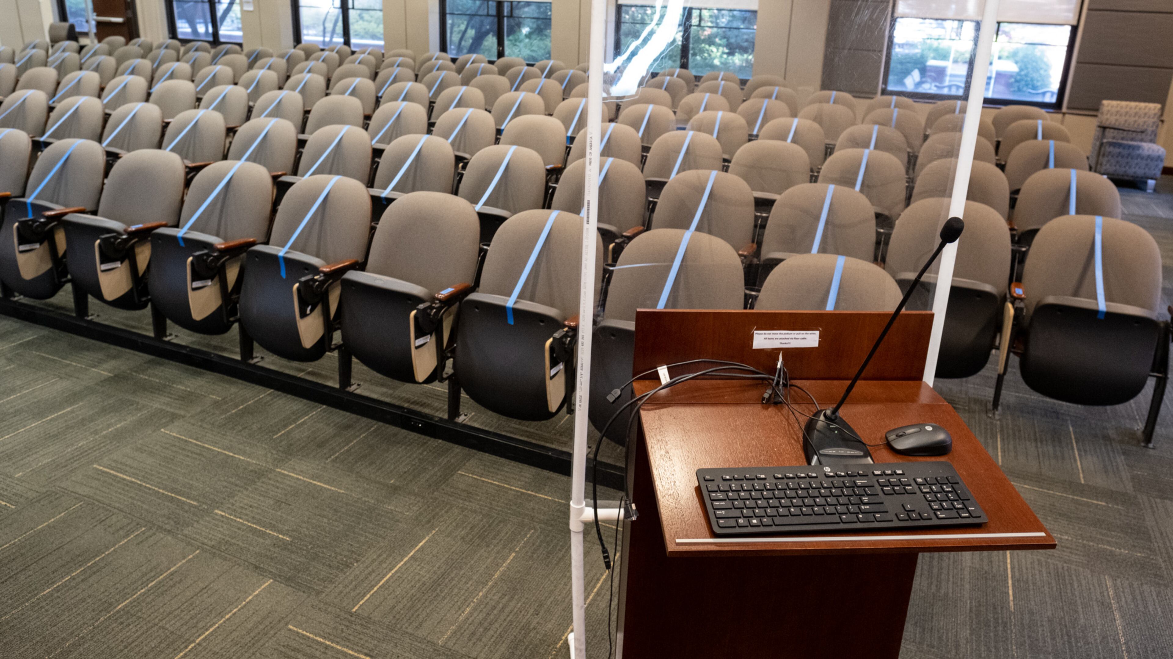 A presentation room in the Bill Moore Student Success Center at Georgia Tech has been converted from a 140-person theater to a 29-student classroom. Because the podium is not quite far enough away from the seats, an acrylic partition has been added for the instructor. Ben Gray for the Atlanta Journal-Constitution