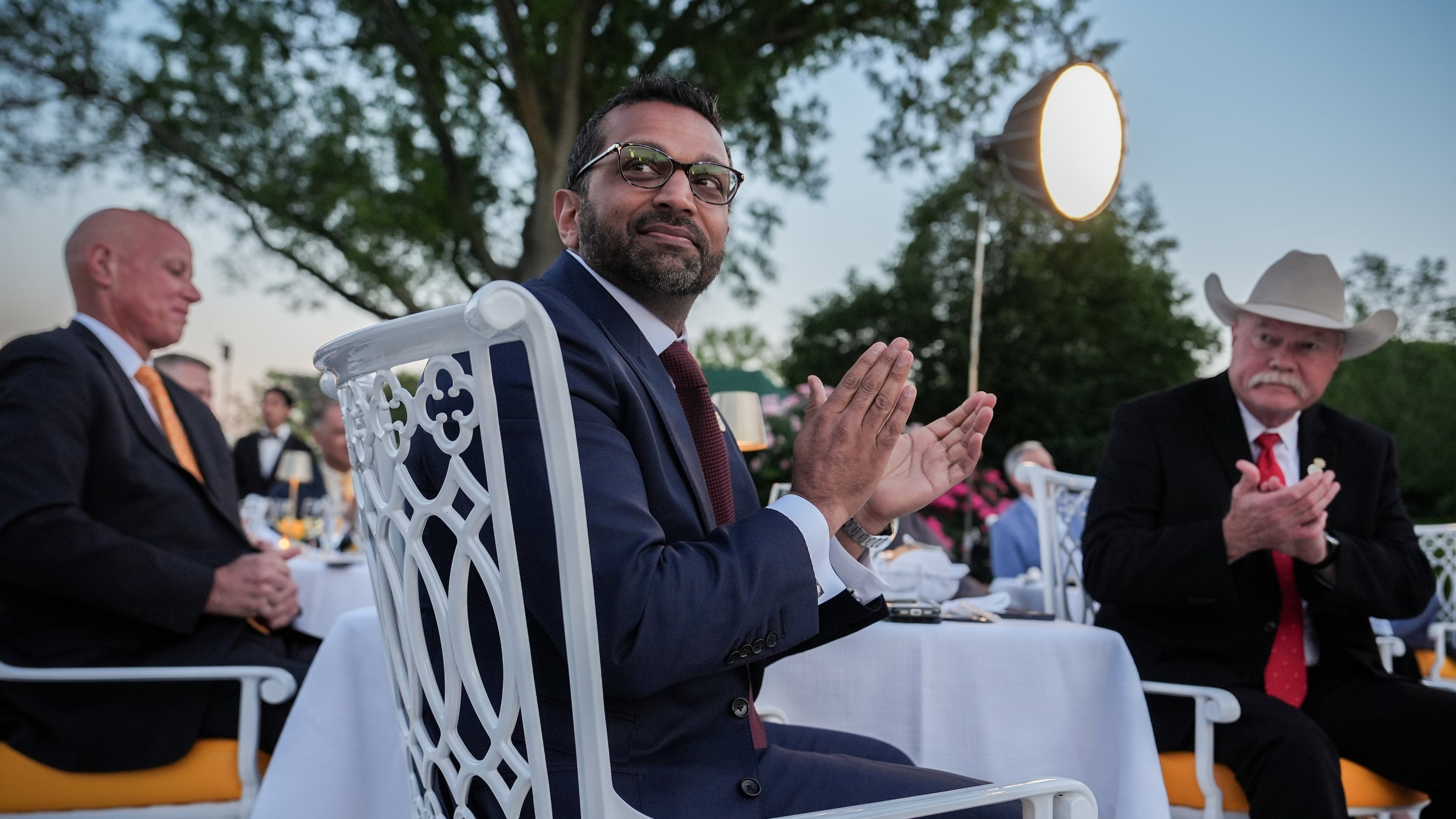 FBI Director Kash Patel applauds the president after speaking at a dinner for members of his administration and law enforcement organization leaders May 11, 2026, in Washington. (Julia Demaree Nikhinson/AP)