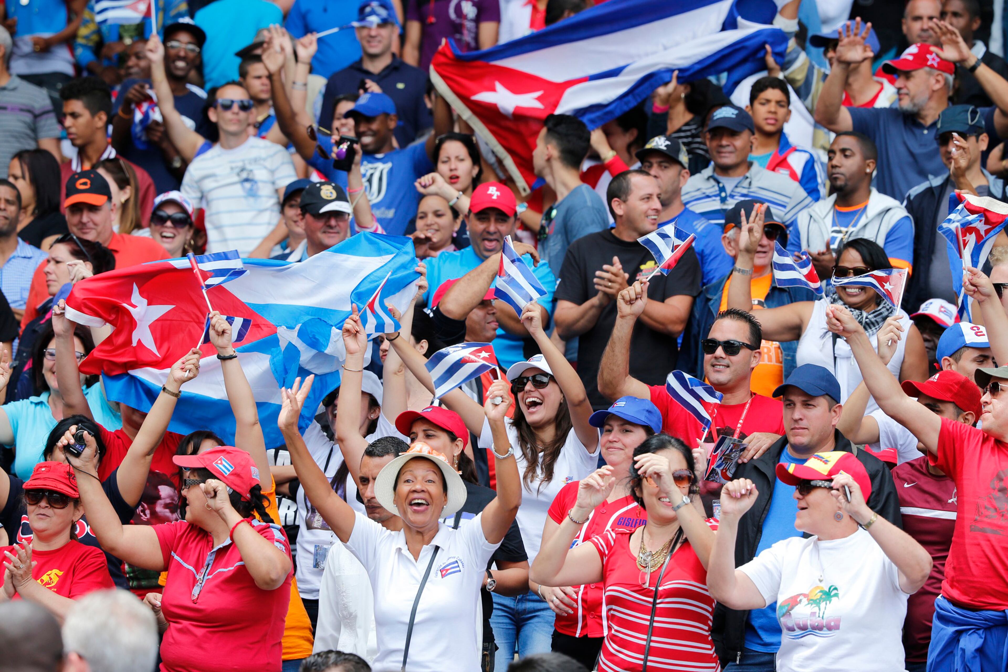 Cuban fans show their team support during the game. (Al Diaz/Miami Herald/TNS)
