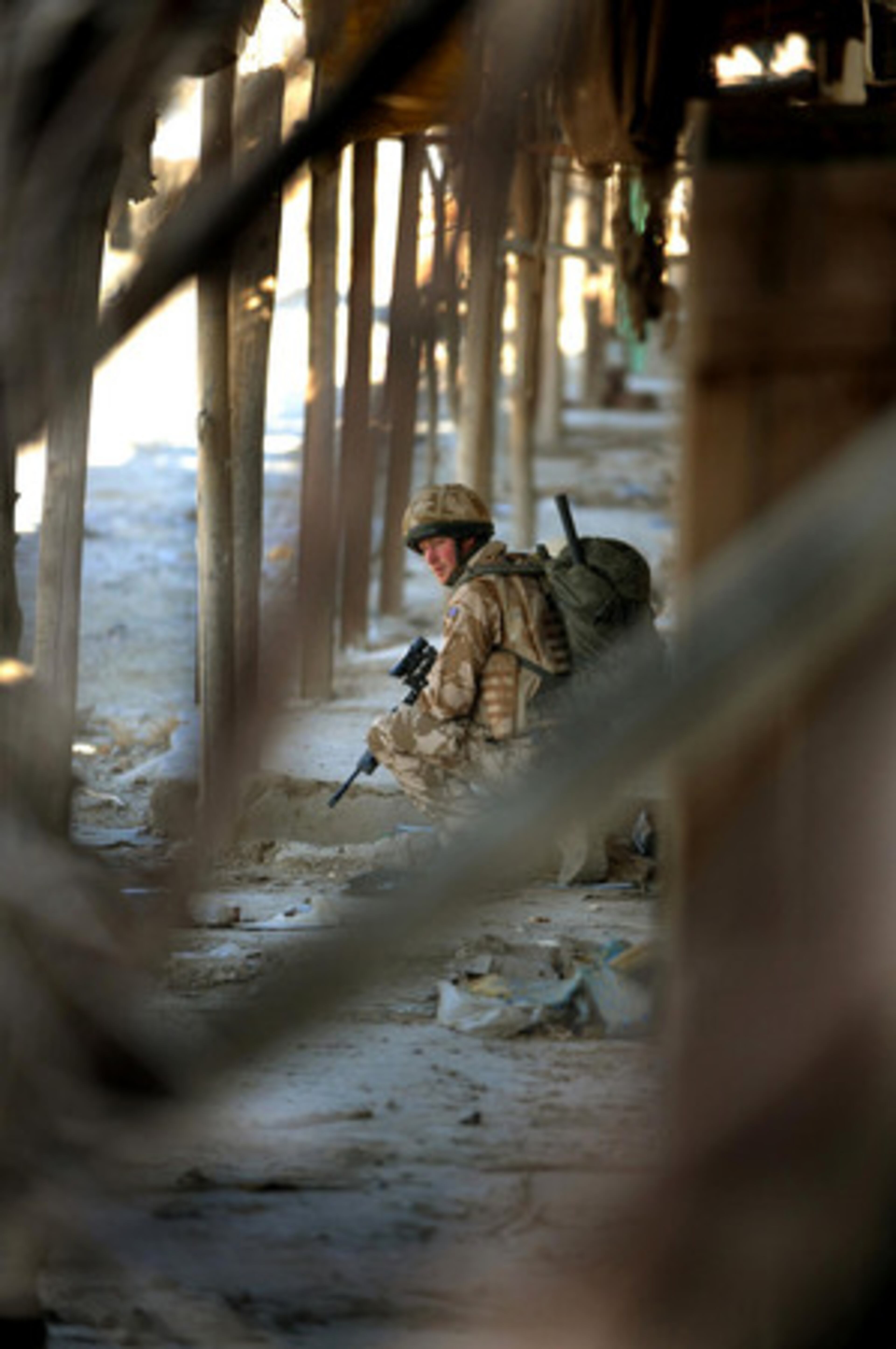 Britain's Prince Harry patrols through the deserted town of Garmisir, Afghanistan, close to Forward Operating Base Delhi, on Wednesday Jan. 2, 2008.