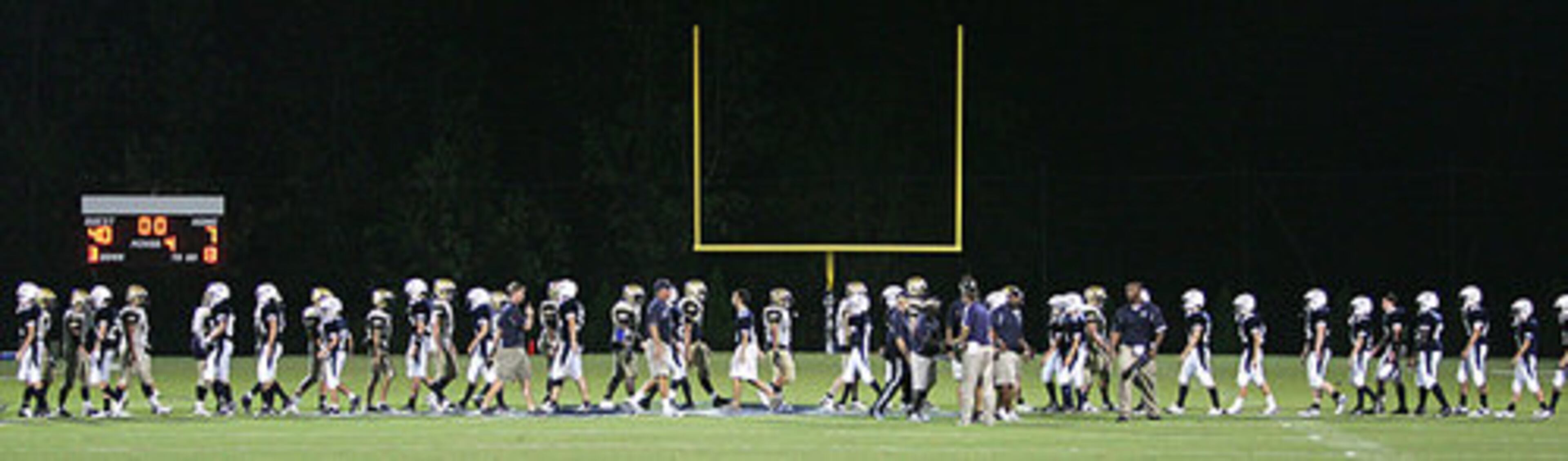 Landmark Christian and Pace Academy players shake hands after the game.