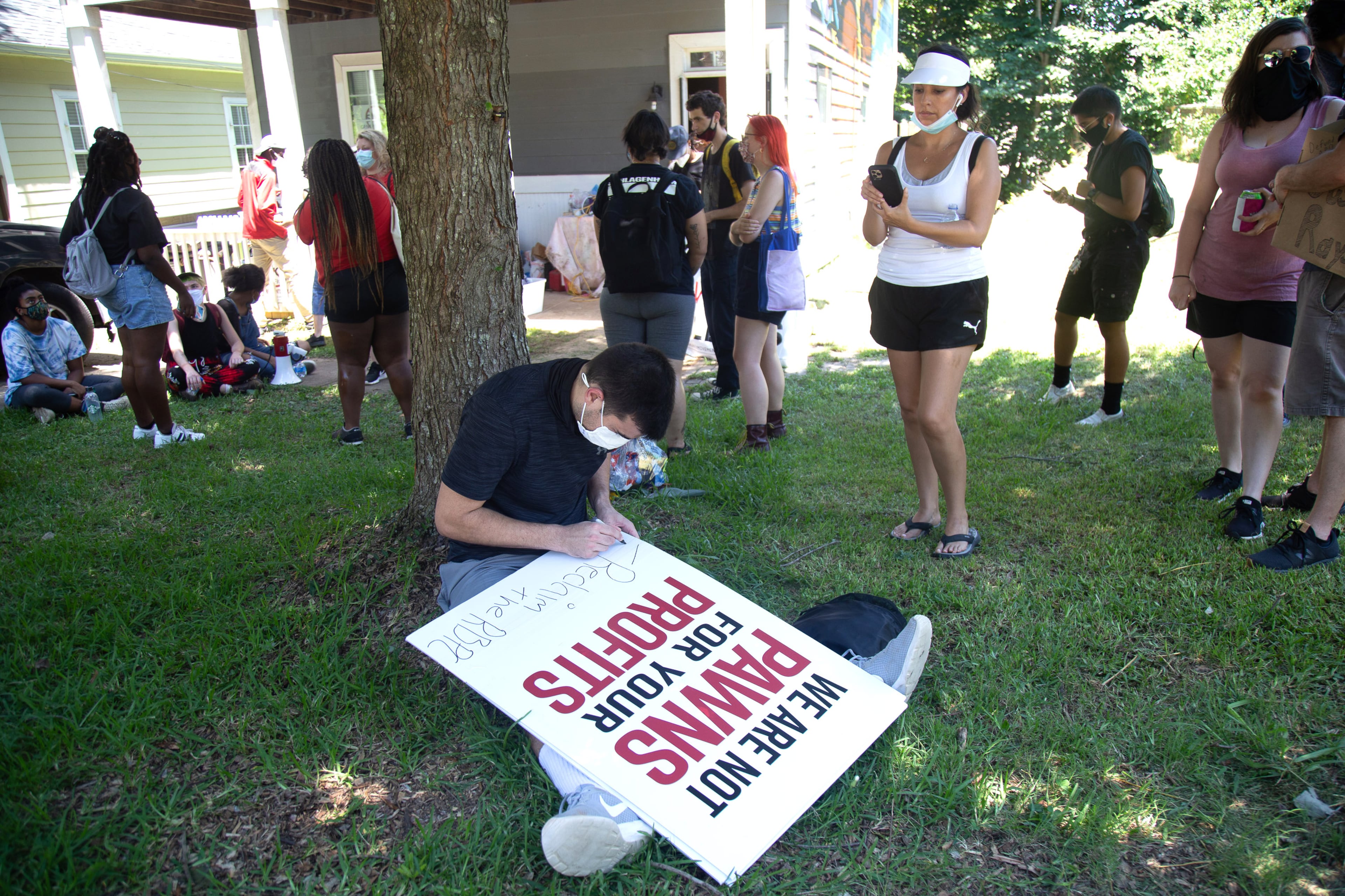 Protesters make signs during the 'Take Back the Wendy's' March & Rally on University Avenue in Atlanta on Saturday, July 11, 2020. The march started at the Community Movement Builders community house and ended at the Wendy's. STEVE SCHAEFER FOR THE ATLANTA JOURNAL-CONSTITUTION