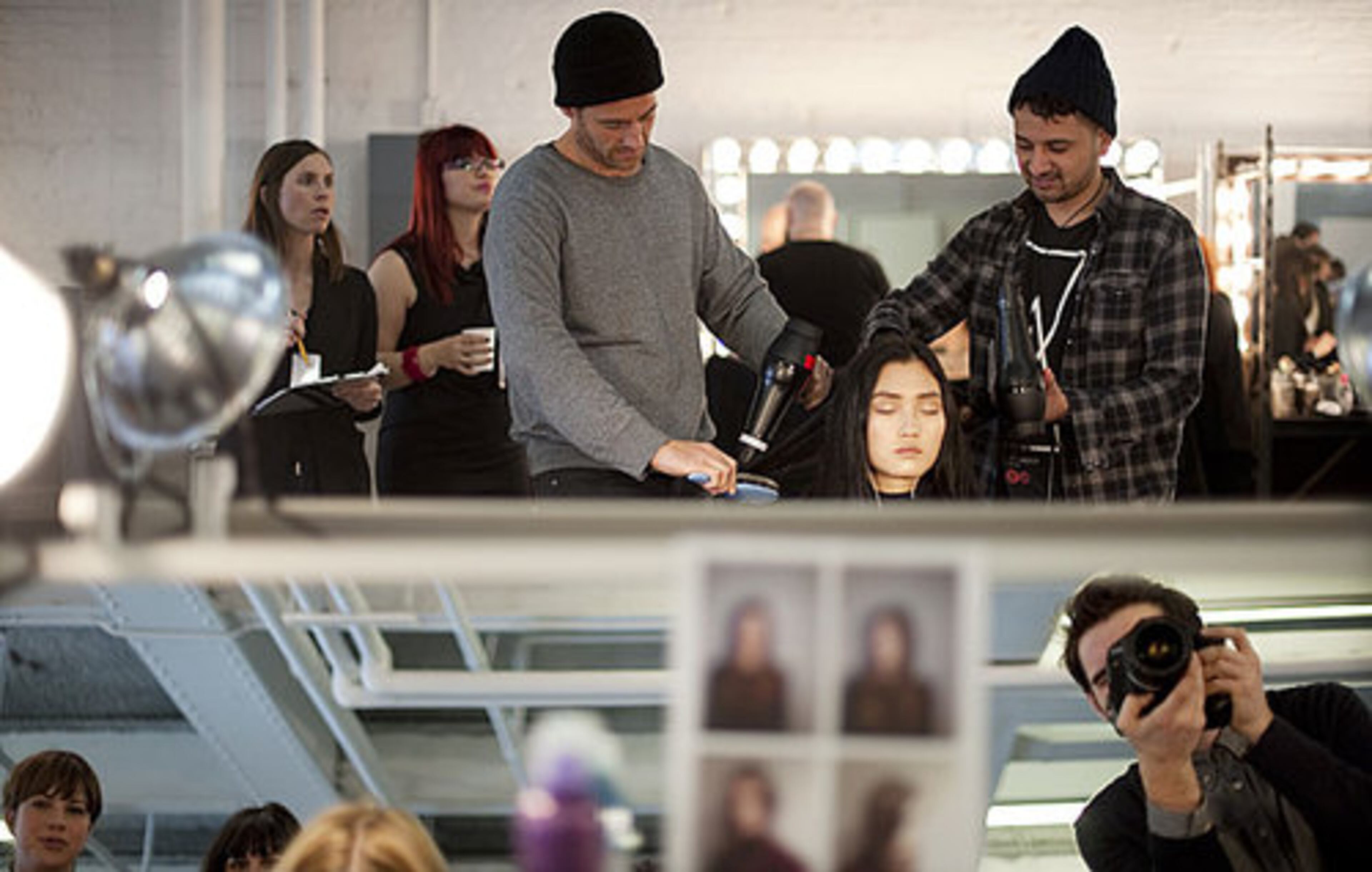 A model gets her hair done backstage at the Yigal Azrouel Fall 2012 fashion show during Fashion Week on Friday, Feb. 10, 2012, in New York.
