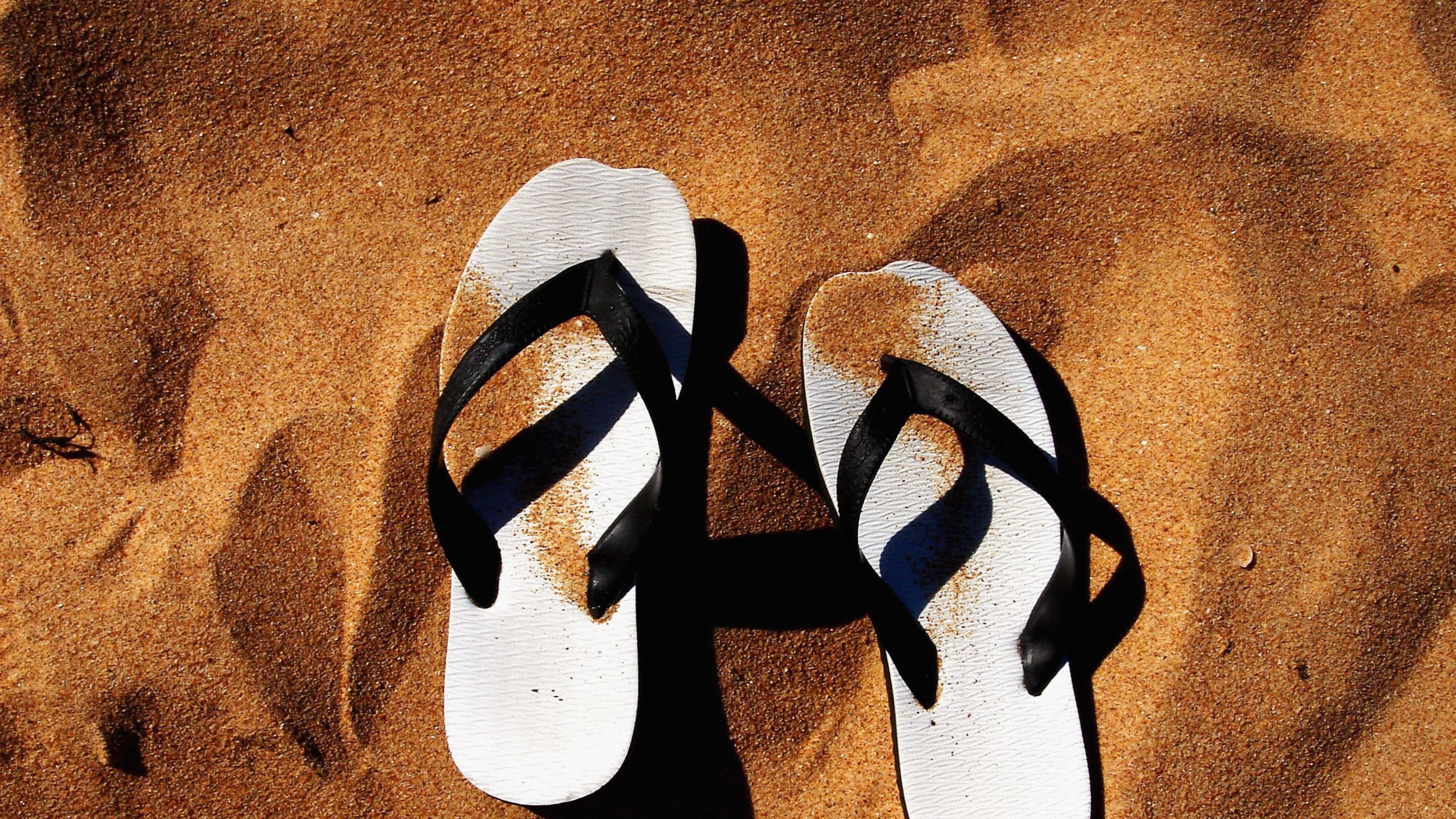 SYDNEY, NSW - JANUARY 21: A pair of thongs lie in the sand on a beach January 21, 2006 in Sydney, Australia. Thongs, also known as "Flip Flops" in Europe or "Jandals" in New Zealand, are a common form of footware worn widely across Australia. The nation will celebrate Australia Day on January 26. (Photo Illustration by Ian Waldie/Getty Images)