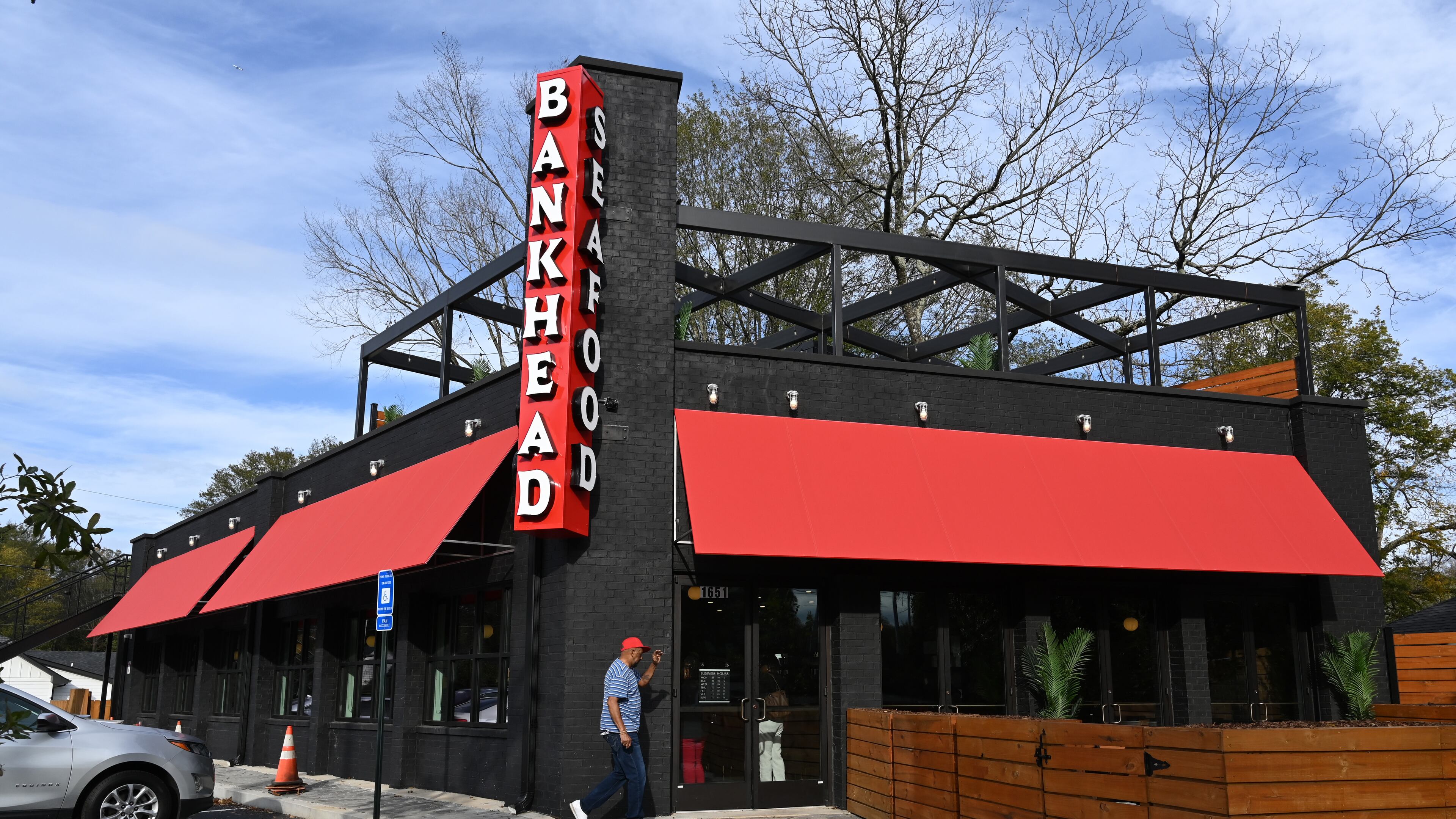 An exterior photo of Bankhead Seafood, which will officially open this Sunday, taken Wednesday, November 13, 2024, in Atlanta. The beloved Grove Park restaurant, located at 1651 Donald Lee Hollowell Parkway, shuttered in 2018 after 50 years in operation. Westside natives Killer Mike and T.I. are partners in the restaurant. (Hyosub Shin / AJC)