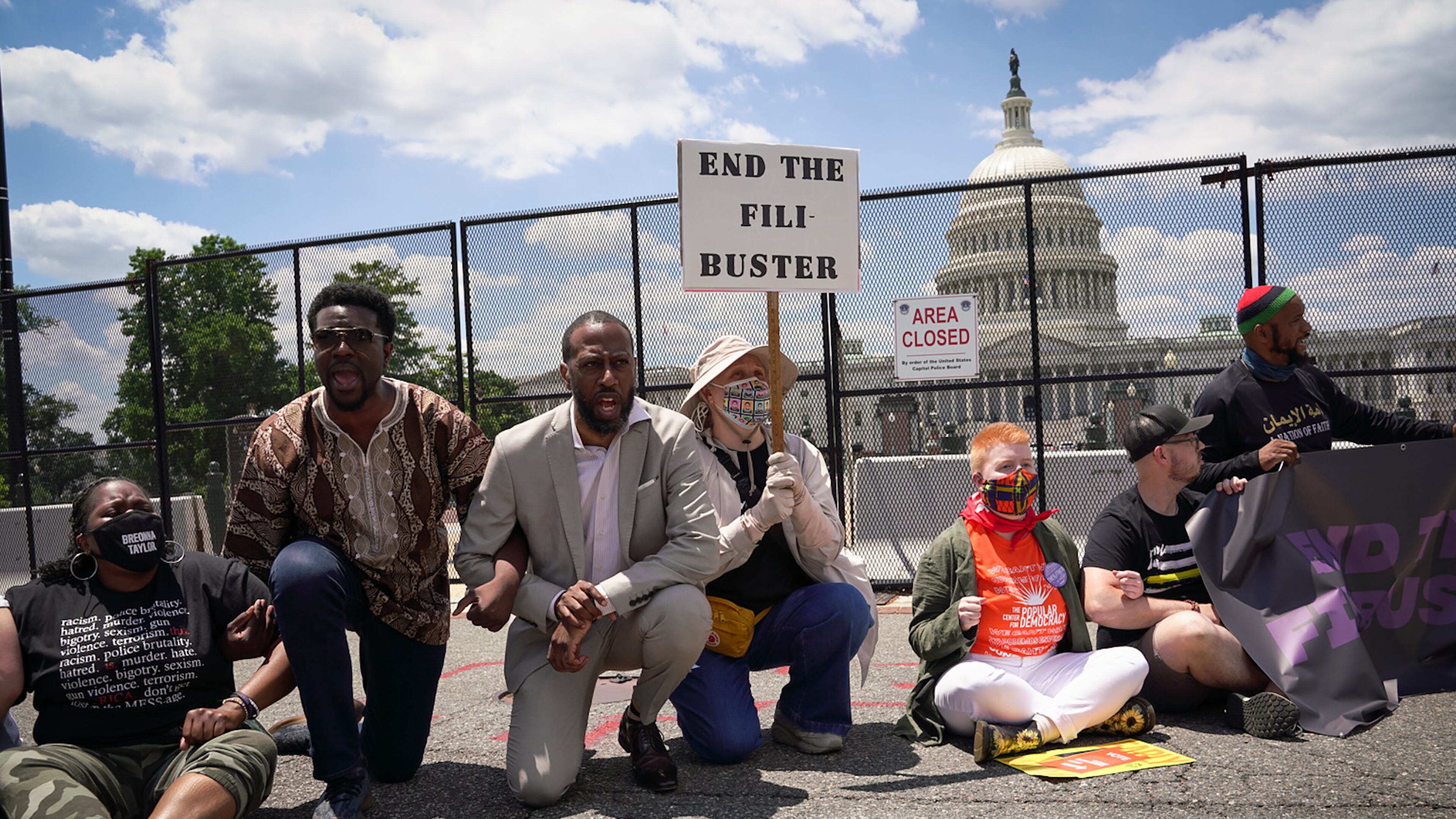 Protesters block a street between the Capitol and the Supreme Court building in Washington, demonstrating for the passage of the For the People Act, and an end to the filibuster. (Sarahbeth Maney/The New York Times)