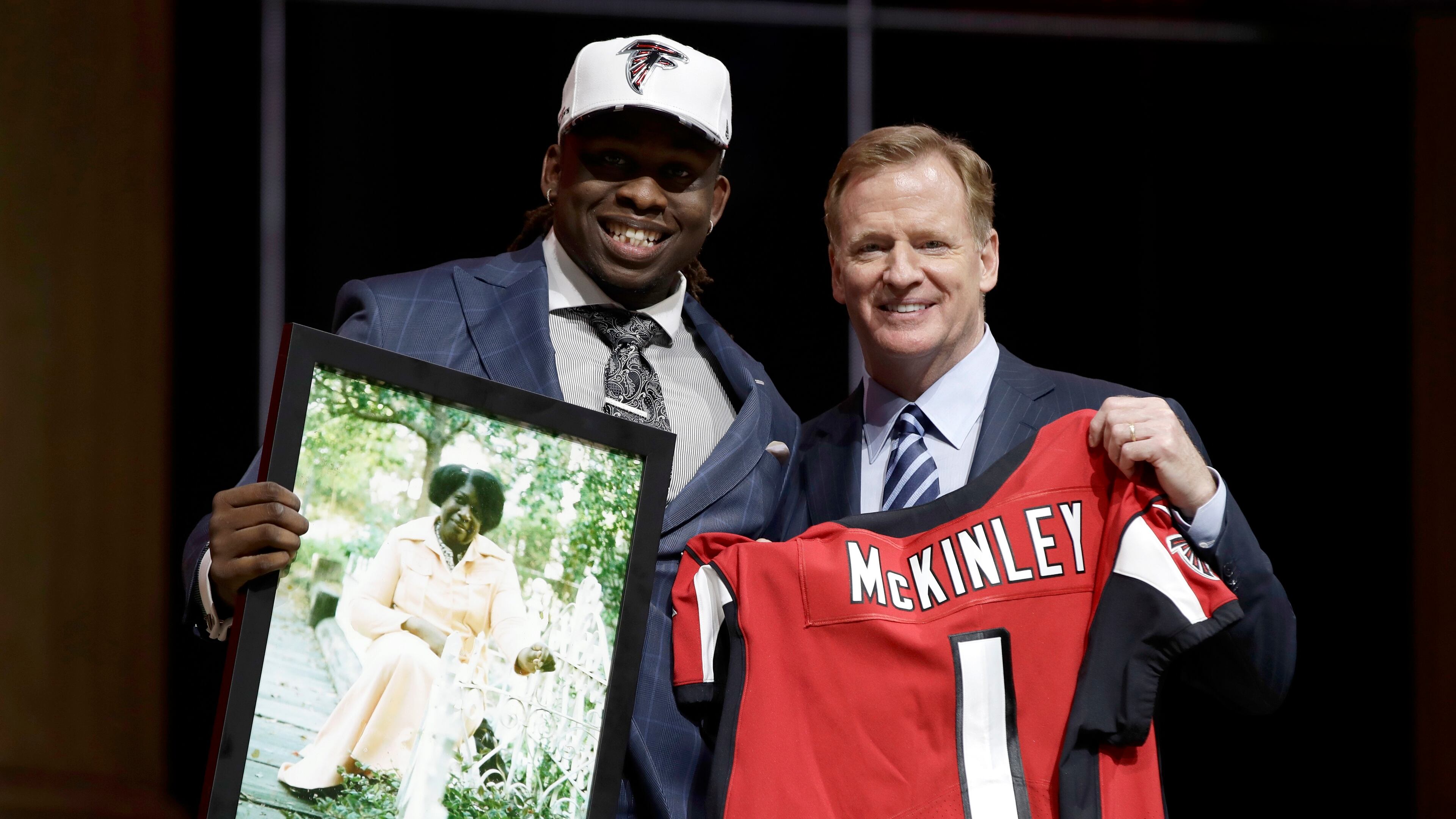 UCLA’s Takkarist McKinley, left, poses with NFL commissioner Roger Goodell after he was selected by the Falcons during the first round of the 2017 NFL draft, Thursday, April 27, 2017, in Philadelphia. (AP Photo/Matt Rourke)