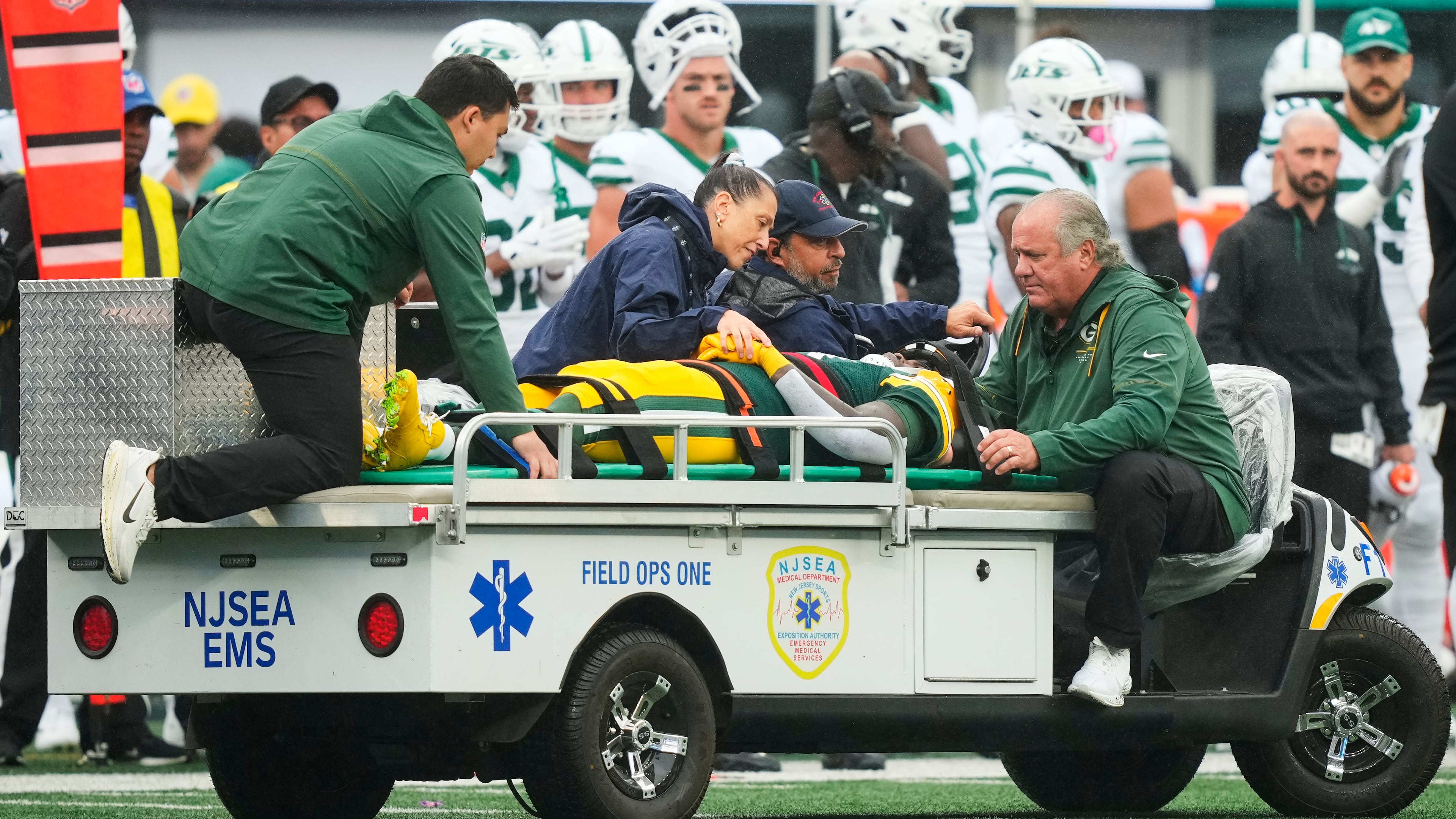 Green Bay Packers wide receiver Jayden Reed (11) is taken off the field following an injury during an NFL football game againt the New York Jets in East Rutherford, N.J., Sunday, Sept. 20, 2026. (AP Photo/Yuki Iwamura)