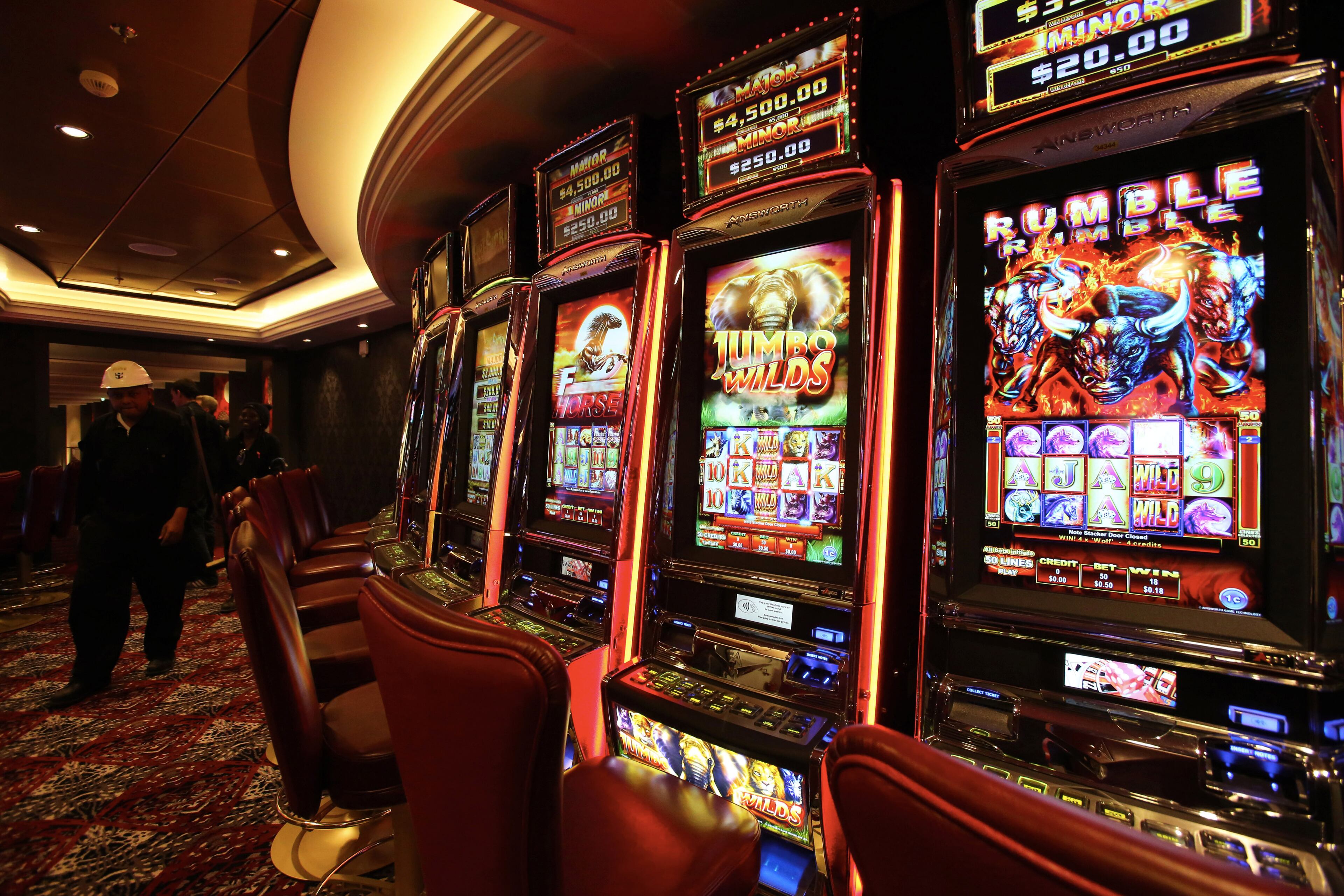 Slot machines are pictured inside the Harmony of the Seas cruise ship during the delivery ceremony of the boat at the STX shipyard in Saint-Nazaire, western France, Thursday, May 12, 2016. With a capacity of 6.296 passengers and 2.384 crew members, the Harmony of the Seas, built by STX France for the Royal Caribbean International, is the world's largest ship cruise. (AP Photo/Laetitia Notarianni)