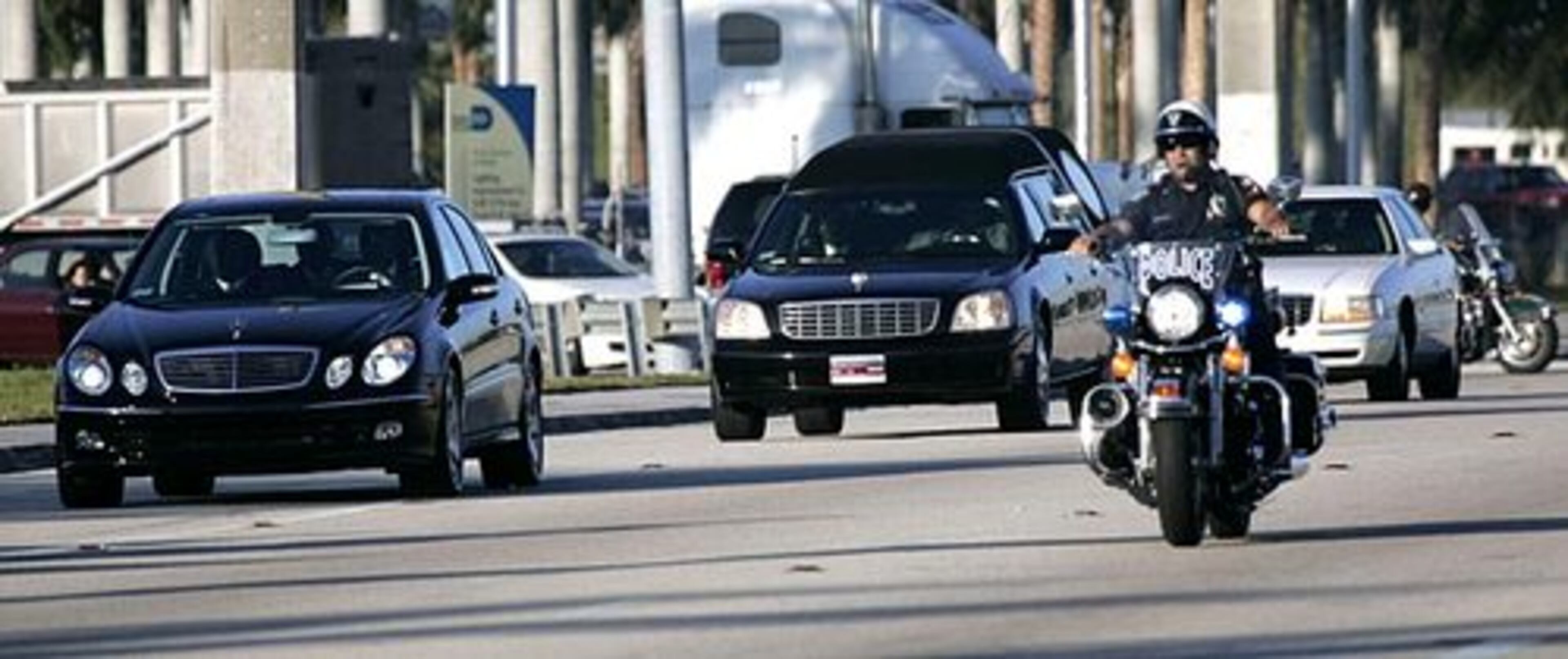 Police escort the Taylor funeral procession to the FIU arena for services Monday. The remembrances for the 24-year-old player began Sunday night. Thousands paid their respects at a wake at Second Baptist Church in south Miami and at a vigil at the University of Miami.