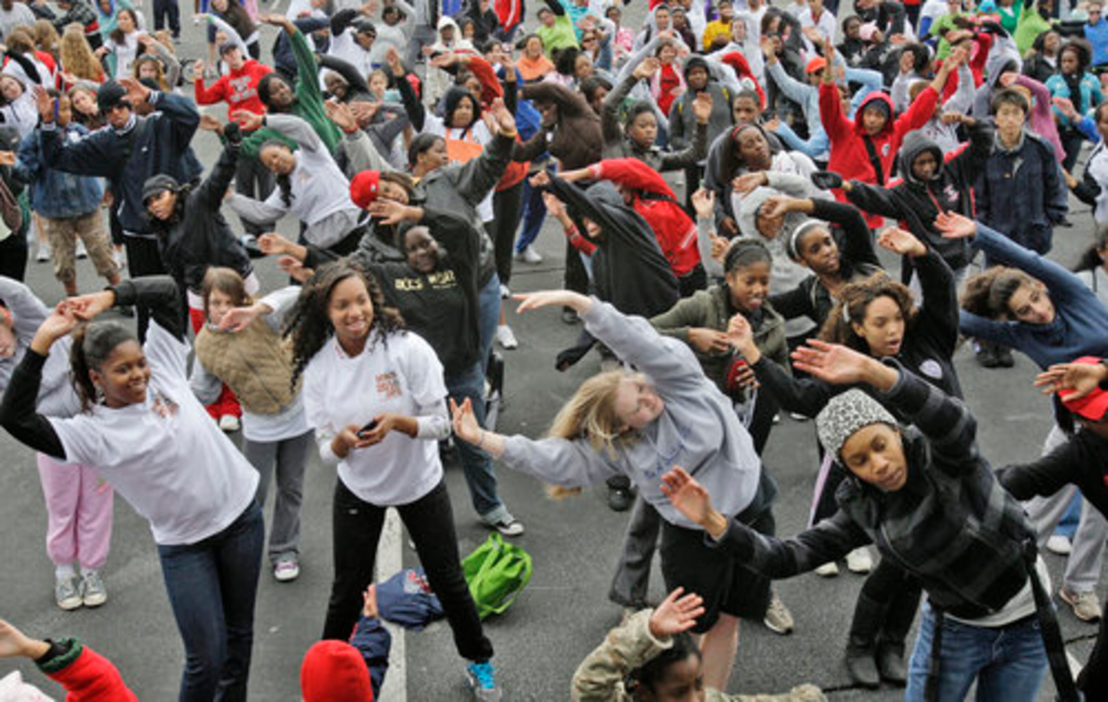 Everyone was called up near the stage for a group warm up and stretch before the walk/run, including this group from Dekalb School of the Arts Beta Club (center). The 26th annual hunger walk in downtown Atlanta. More than 10,000 participants were expected to gather at Turner Field to run and walk the 5K route through Downtown Atlanta. Hunger Walk/Run benefits the Atlanta Community Food Bank and five other local nonprofits with hunger relief progr