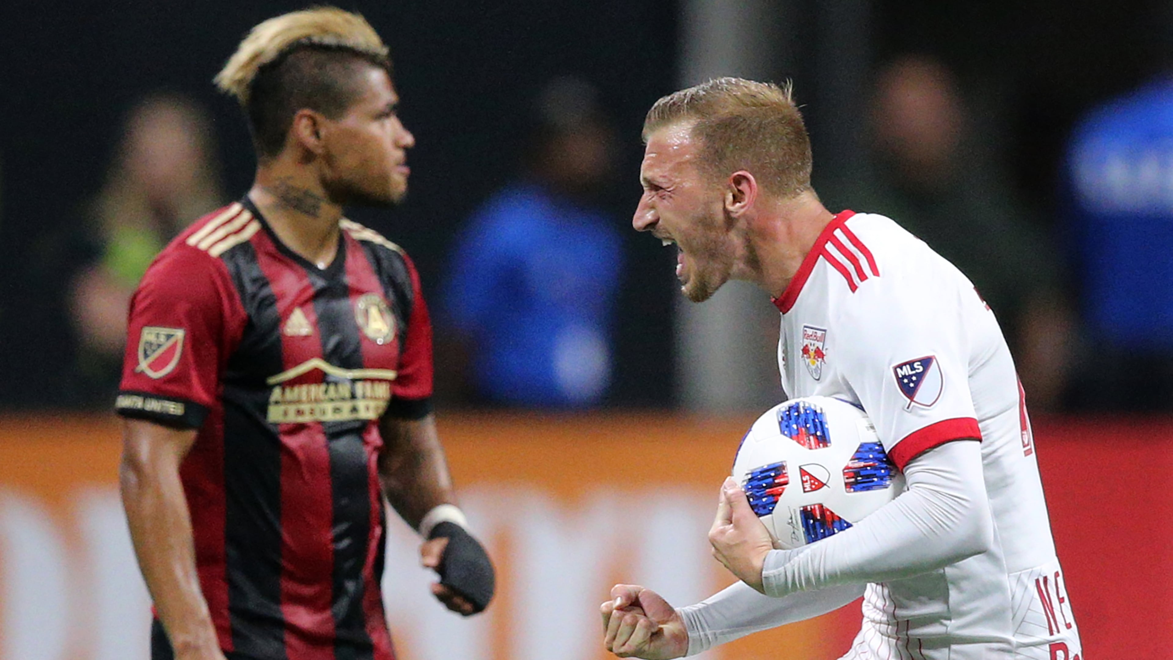 New York Red Bulls midfielder Daniel Royer celebrates scoring a goal on a free kick to tie the game 1-1 as Josef Martinez looks on during the first half Sunday, May 20, 2018, in Atlanta. The Red Bulls won the match 3-1.