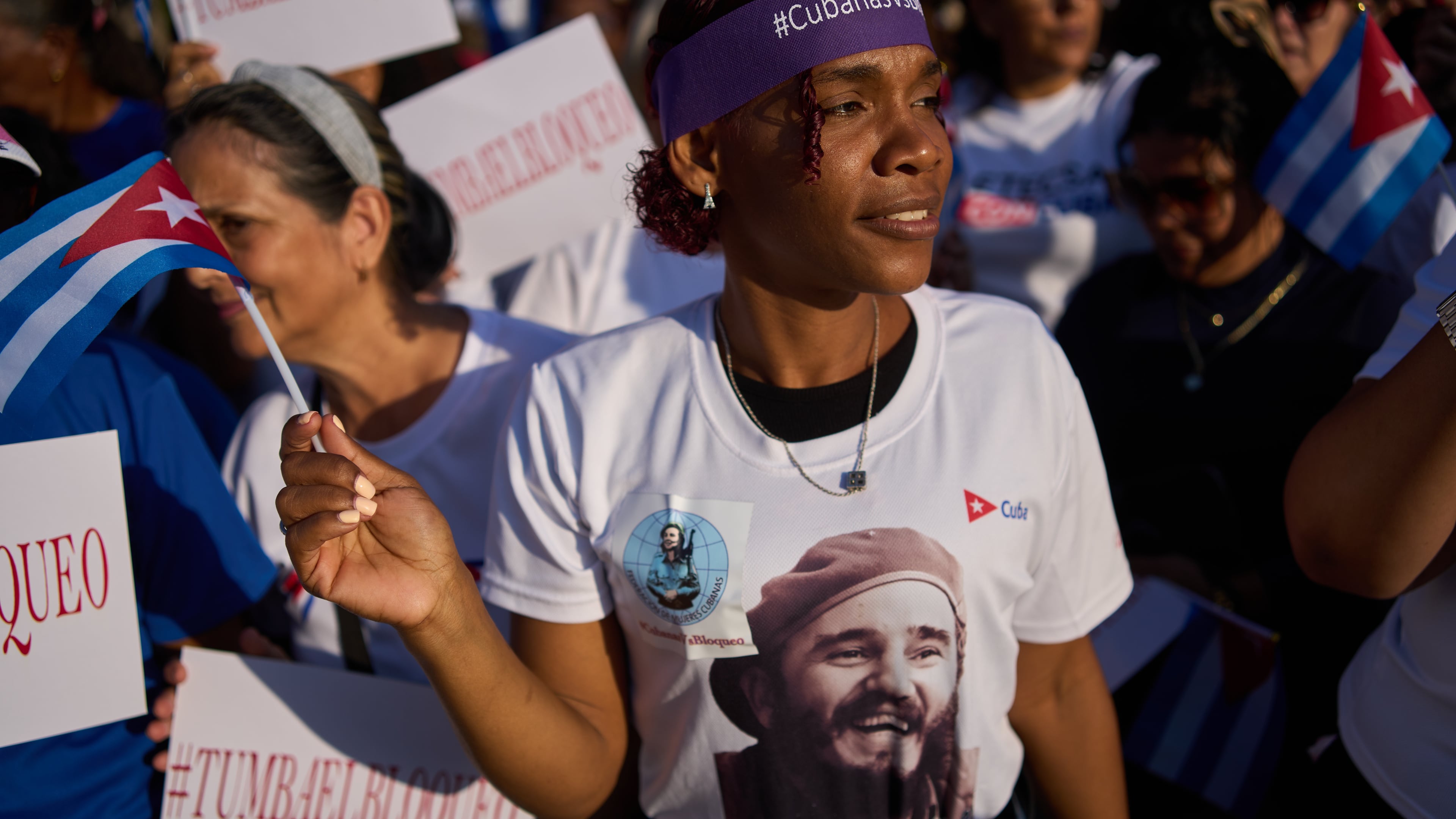A woman attends a rally calling for the end of the U.S. blockade against the island nation in Havana, Cuba, Tuesday, April 7, 2026. (AP Photo/Ramon Espinosa)