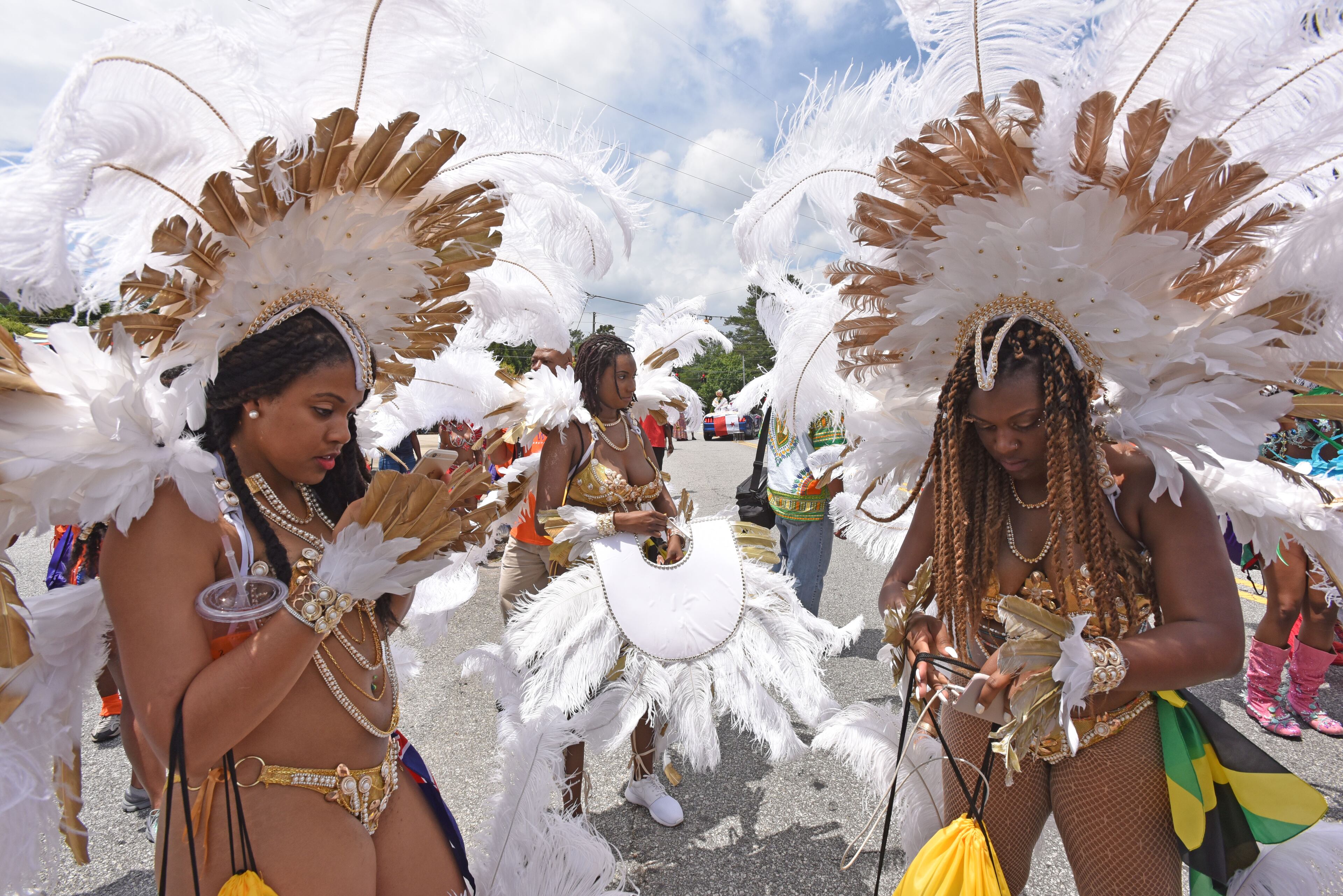 May 27, 2017 Decatur - Parade participants gather and prepare at Kensington MARTA Station for the departure of Atlanta Caribbean Carnival Parade in Decatur on Saturday, May 27, 2017. The parade is hosted by Atlanta Carnival Bandleaders Council (ACBC) to promote a broader understanding and a deeper appreciation of Caribbean culture among the Atlanta community by seeking the interest of carnival bands and steel bands, and using the Atlanta Caribbean Carnival as a vehicle for the promotion of Caribbean culture. HYOSUB SHIN / HSHIN@AJC.COM