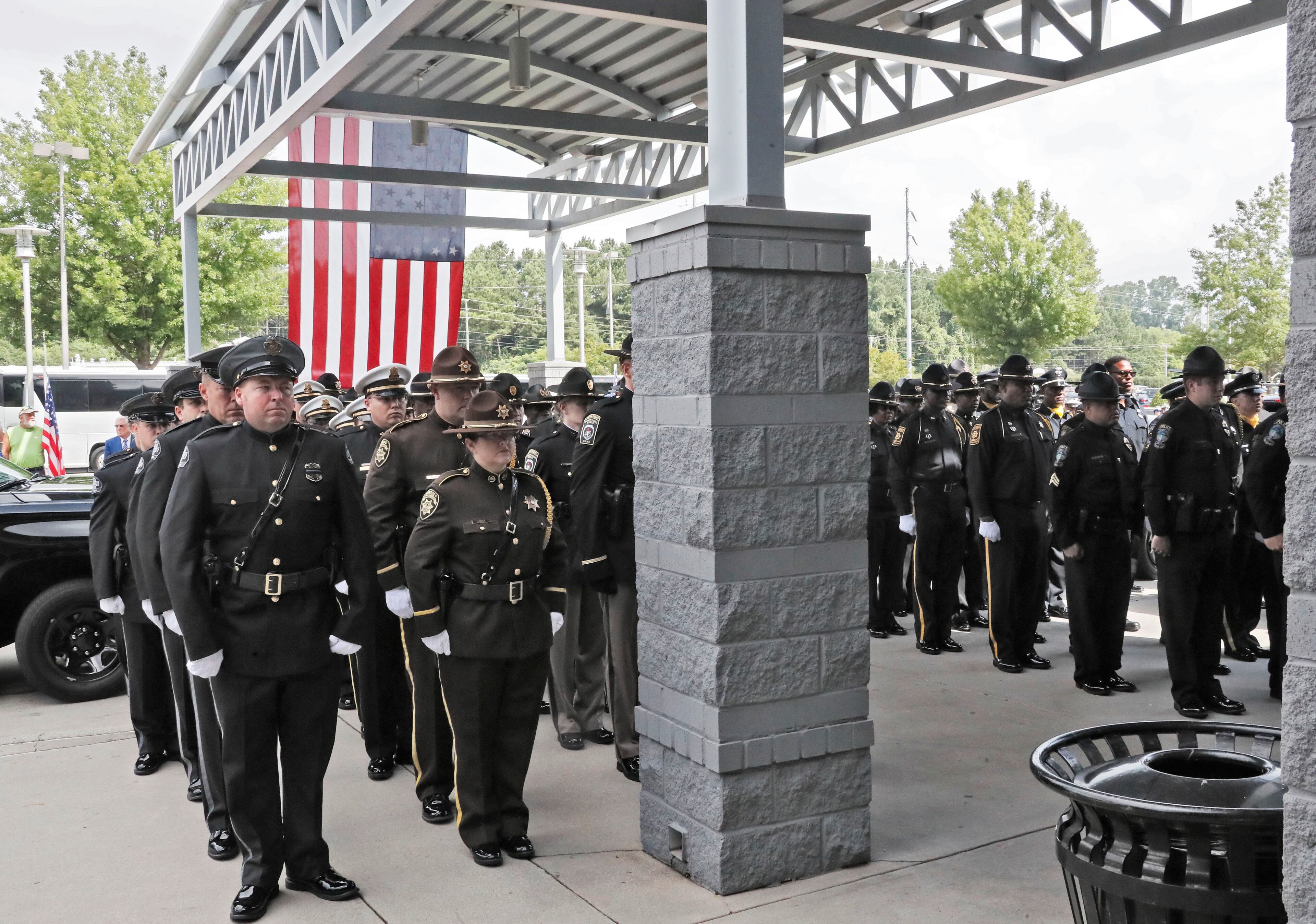 July 11, 2019, 2019 - Gainesville - Honor Guard members from police departments throughout Georgia stand at attention after family members of slain Hall County Sheriff's Deputy Nicolas Blane Dixon entered the church. A funeral service was held for slain Hall County Sheriff's Deputy Nicolas Blane Dixon, the fourth Georgia law enforcement officer killed in the line of duty this year. The service was held at Free Chapel Worship Center in Gainesville. Bob Andres / bandres@ajc.com