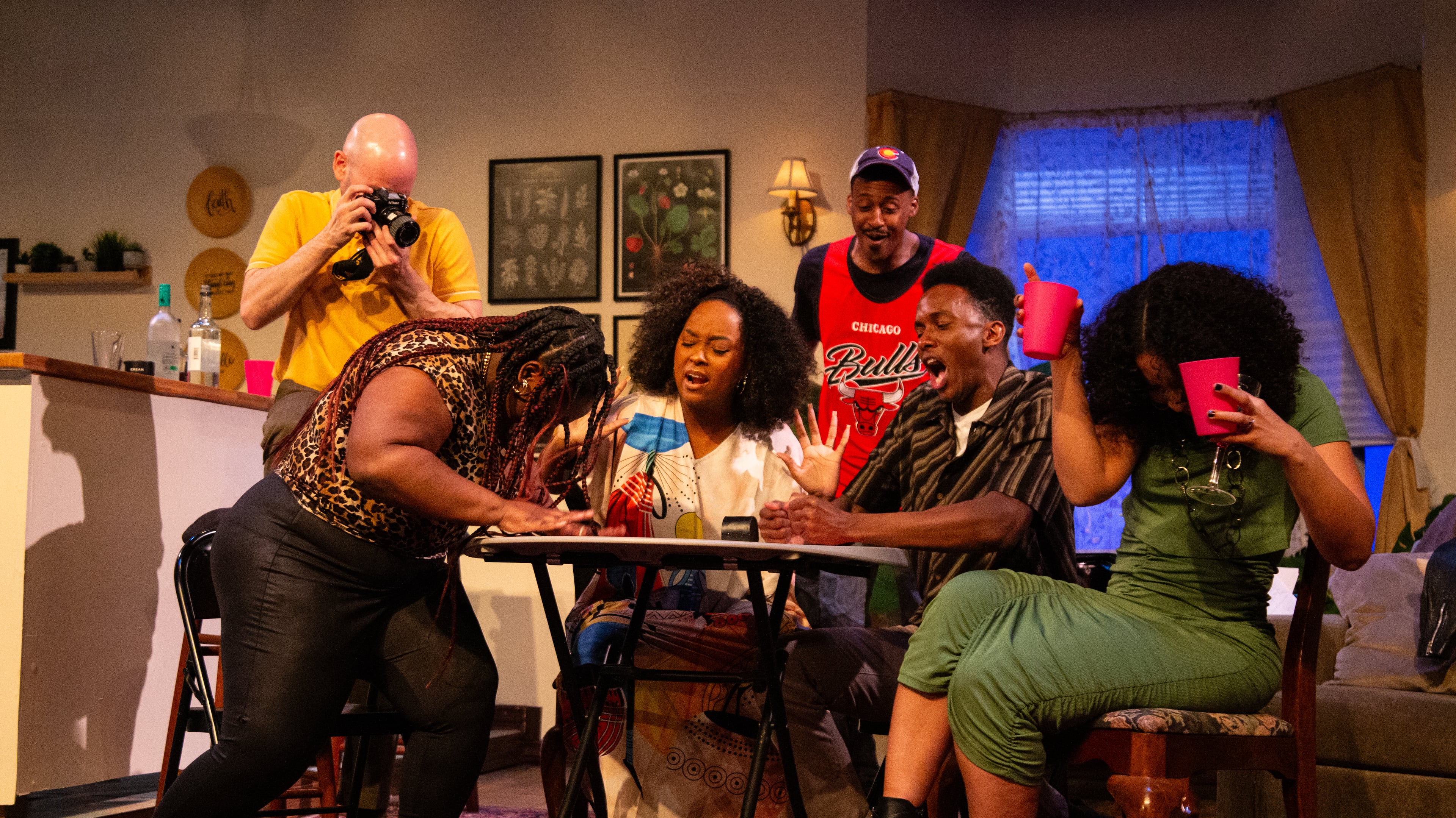 During a card game in "Immediate Family," tensions escalate among the characters played by (from left) Jeff Hathcoat, Kierra Danielle, Irene Polk, Elliott Young, Jason Jamal Ligon and Catherine Campbell. The show continues through March 29.