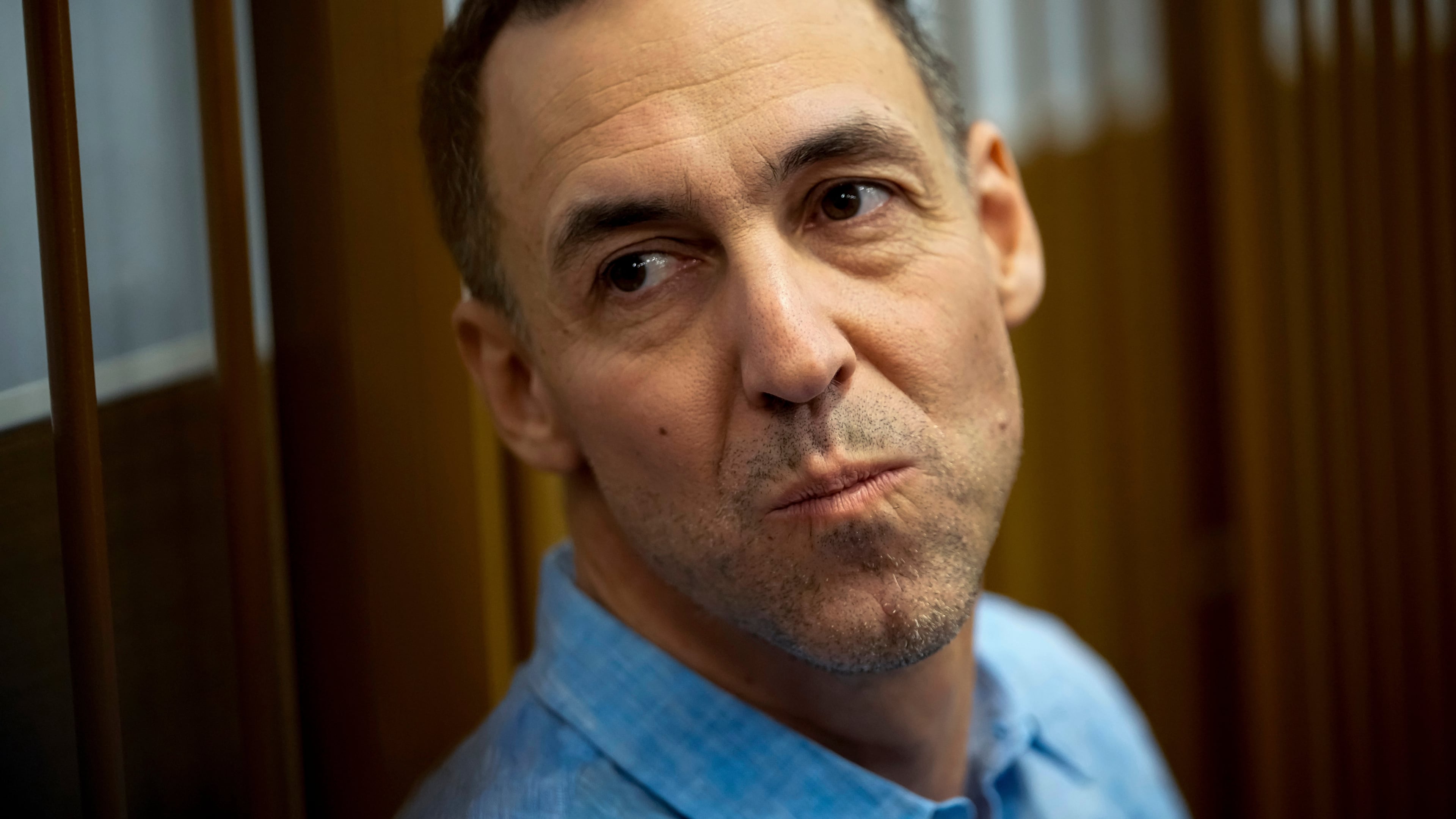 FILE - French citizen Laurent Vinatier sits in a cage prior to a court session at the Zamoskvoretsky District Court in Moscow, Russia, on Monday, Oct. 14, 2024. (AP Photo/Pavel Bednyakov, File)
