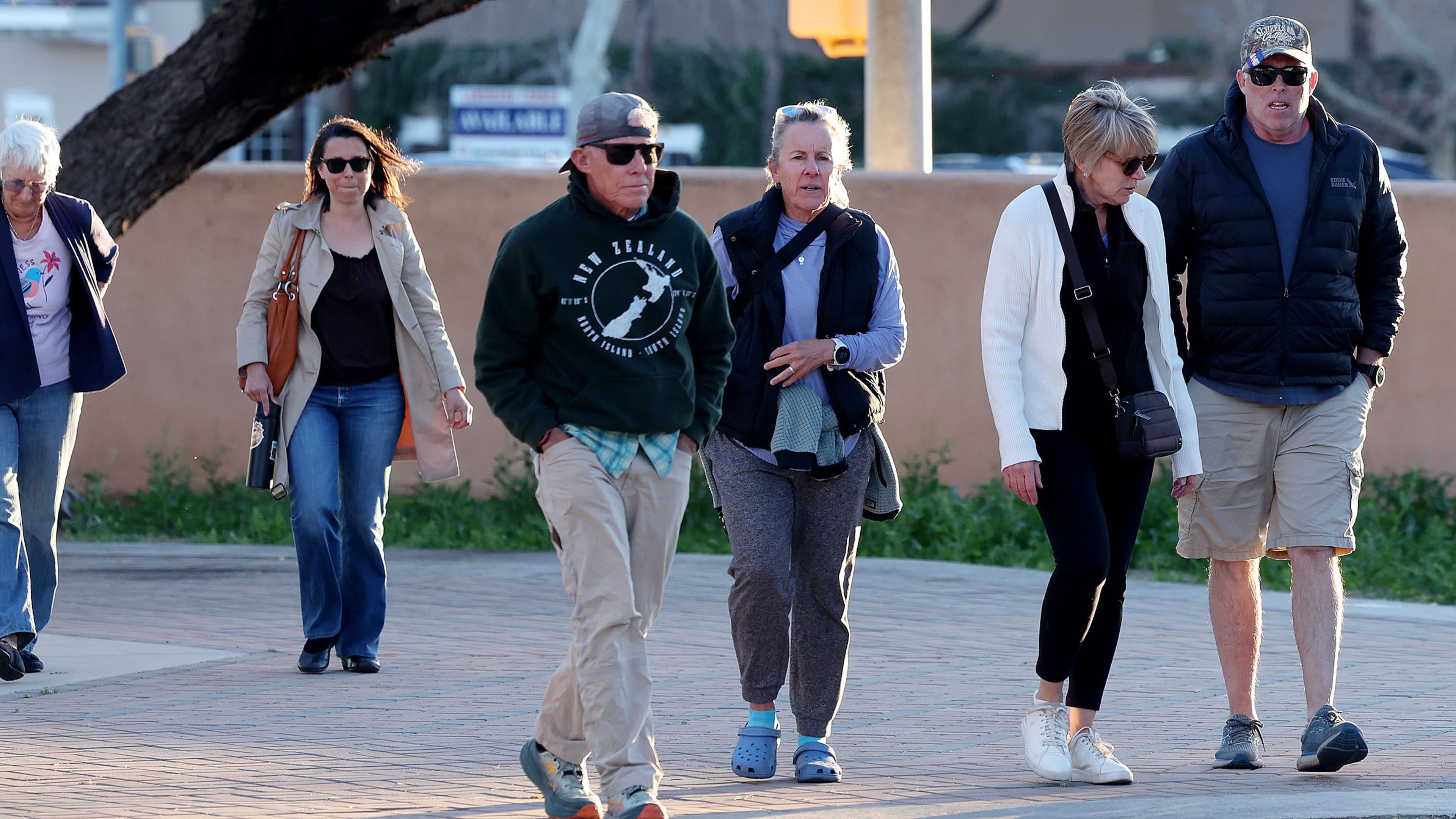 A group of people walk up to St. Philip's in the Hills Episcopal Church to attend the candlelight service for Nancy Guthrie, the 84-year-old mother of NBC "Today" show host Savannah Guthrie in Tucson, Ariz. on Wednesday, Feb. 4, 2026. (Mamta Popat/Arizona Daily Star via AP)