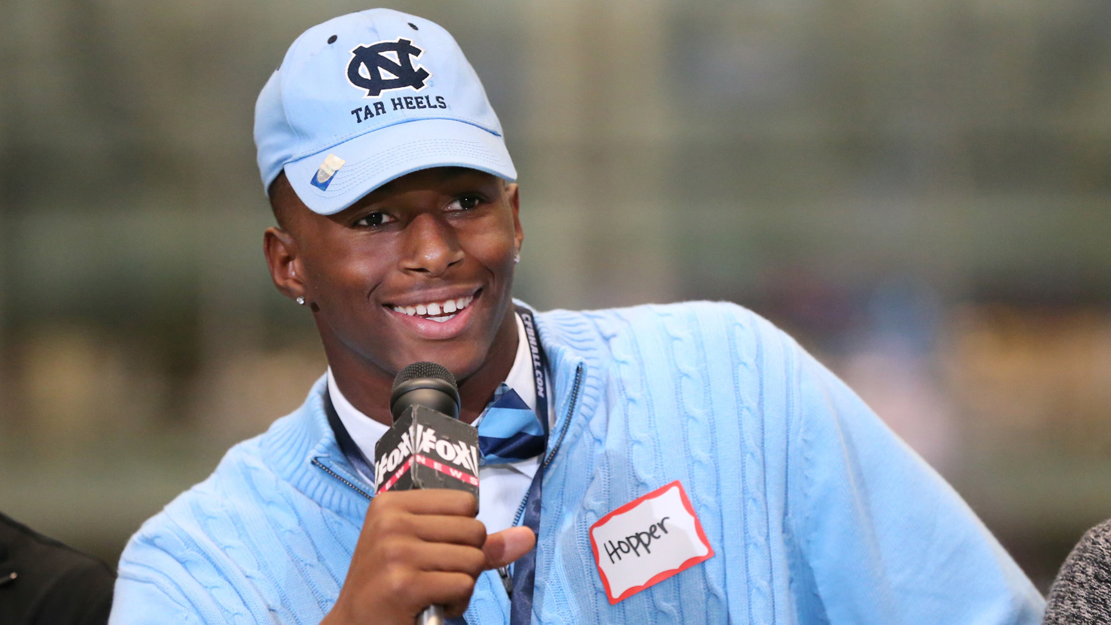 Tyrone Hopper, from Roswell, is decked out in Carolina blue on his way to the Tar Heels during national signing day Wednesday, Feb, 3, 2016, in Atlanta.