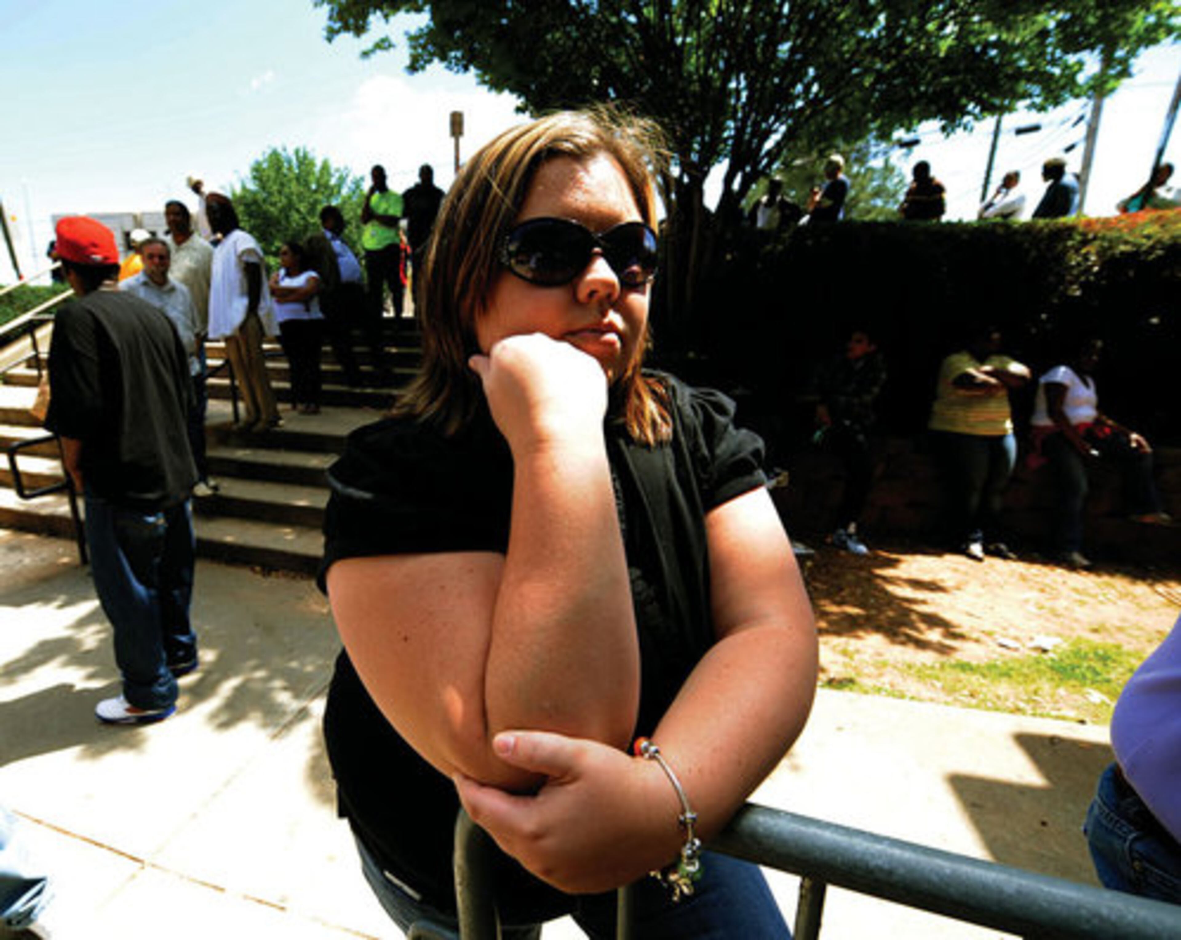 Rebecca Turner waits in line with others hoping to have her day in DeKalb Records Court on Wednesday, April 28.
