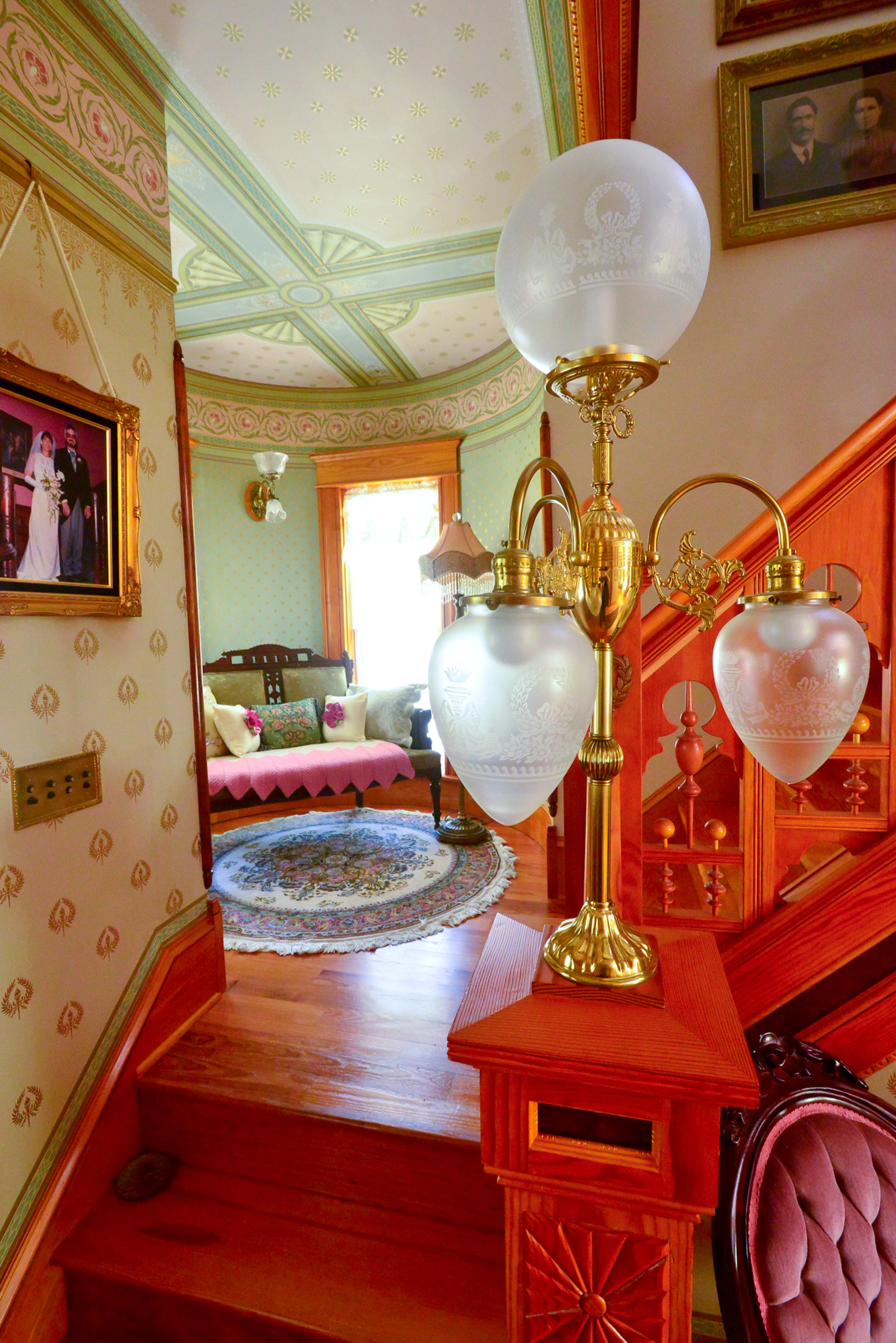 Homeowner Mike Dufano also designed the light fixtures, which fit with the Queen Anne interiors in his Grant Park home.