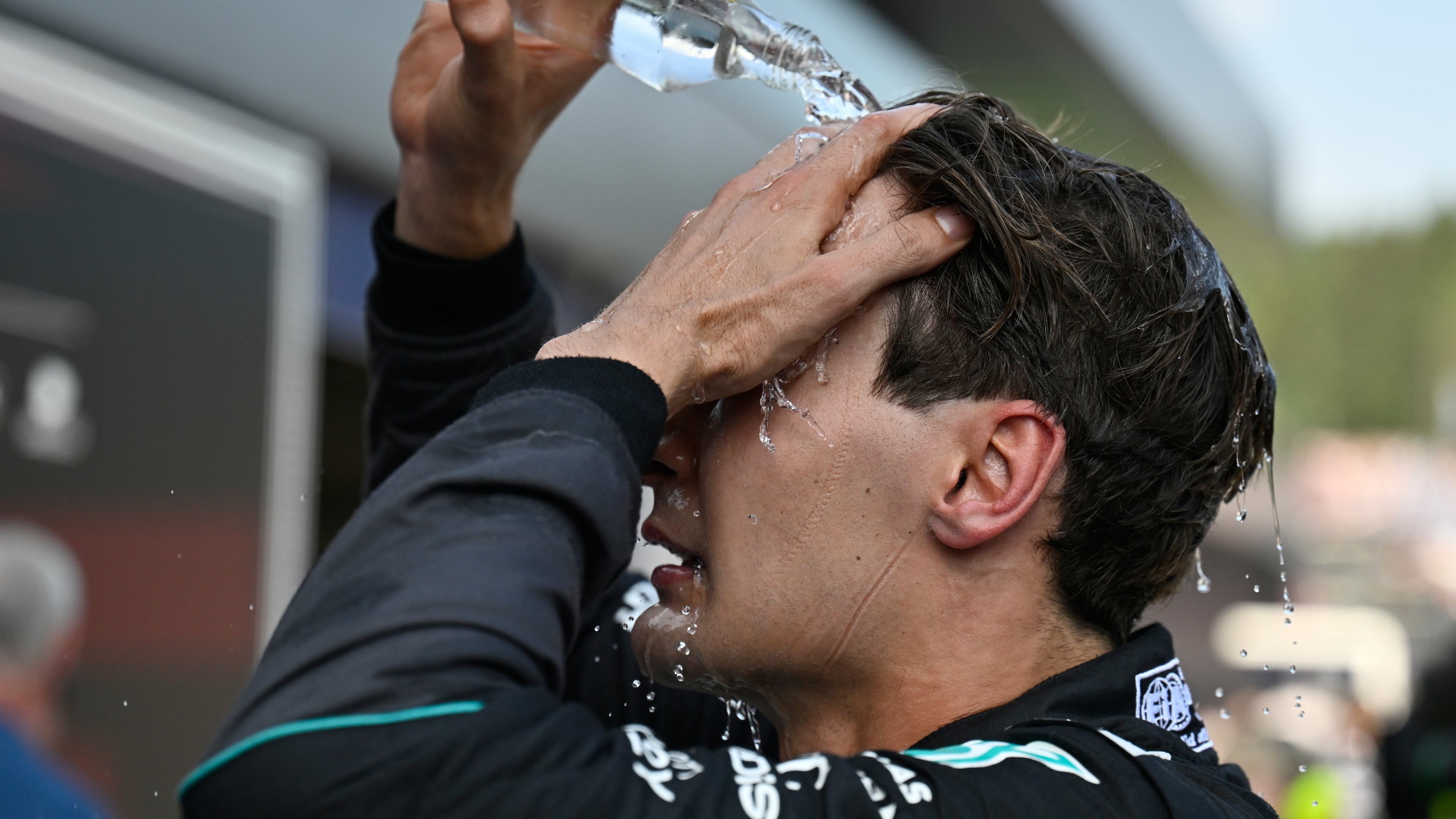 Race winner Mercedes driver George Russell of Britain refreshes himself after the Austrian F1 Grand Prix, in Spielberg, Austria, Sunday, June 28, 2026. (AP Photo/Denes Erdos)